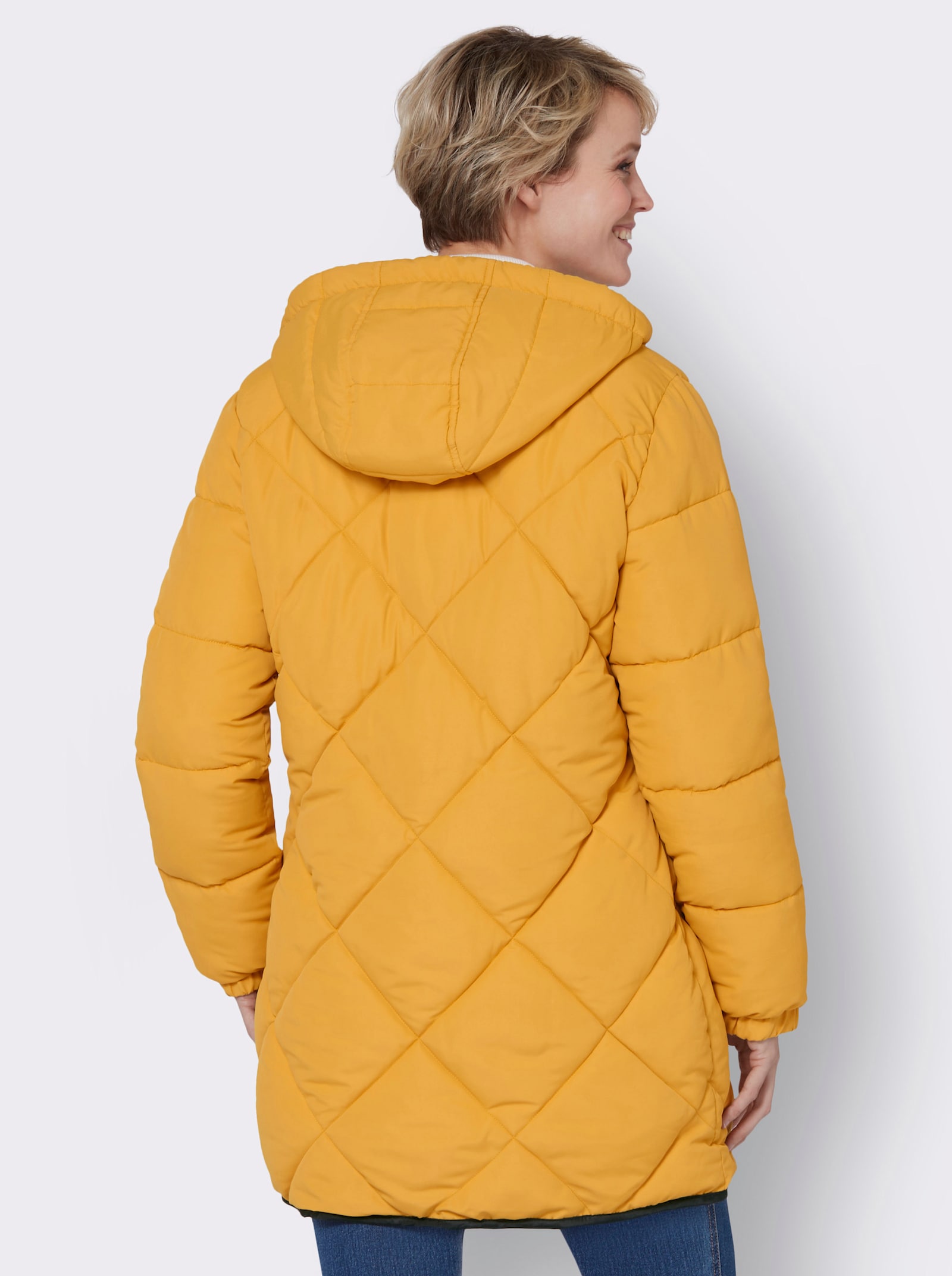 Dlouhá bunda s elastickými náplety - okrová