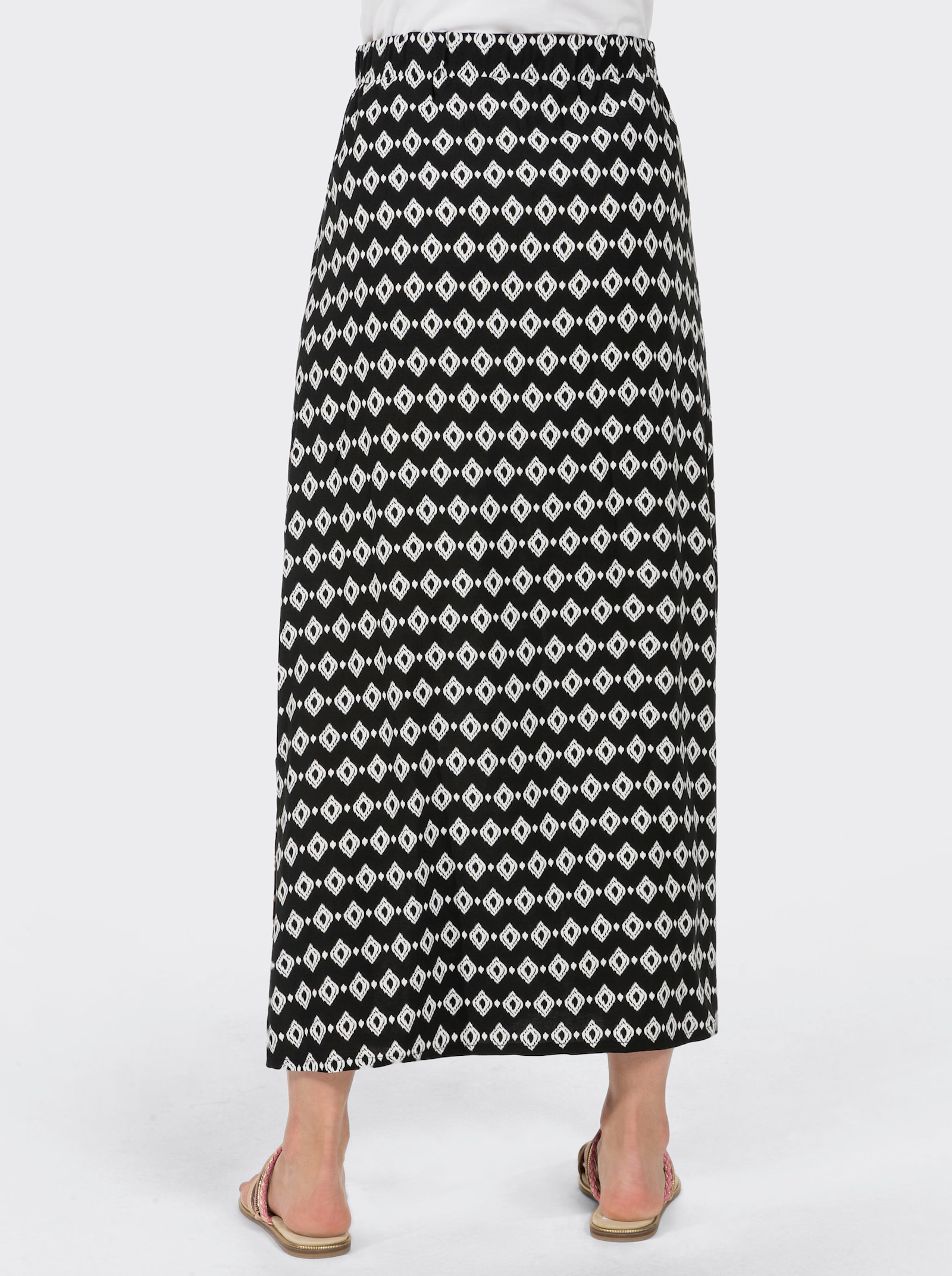 Schlupfrock mit langen Seitenschlitzen - schwarz-gemustert