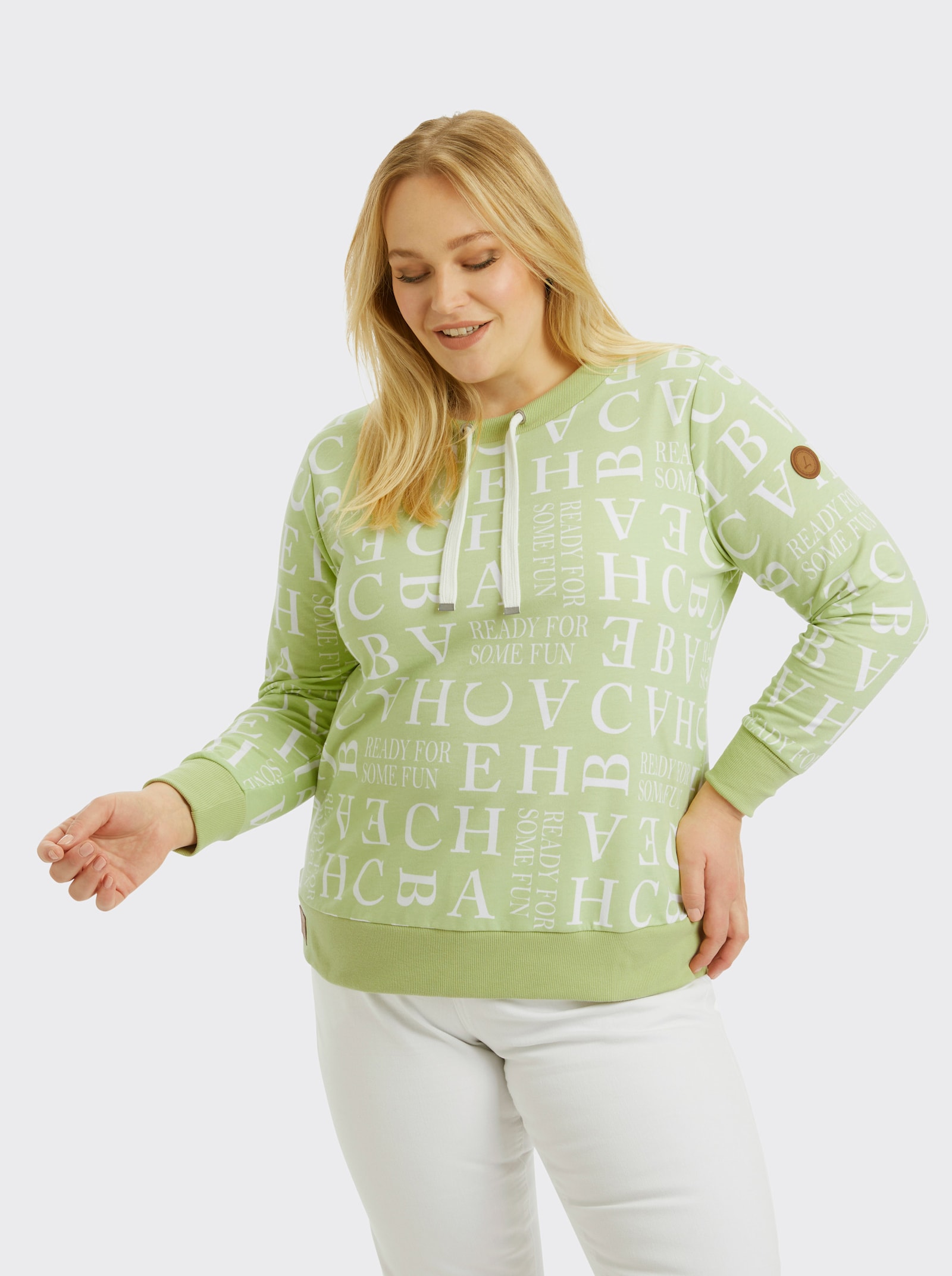 Sweatshirt mit Kordeldurchzug am Ausschnitt - pistazie-ecru-bedruckt