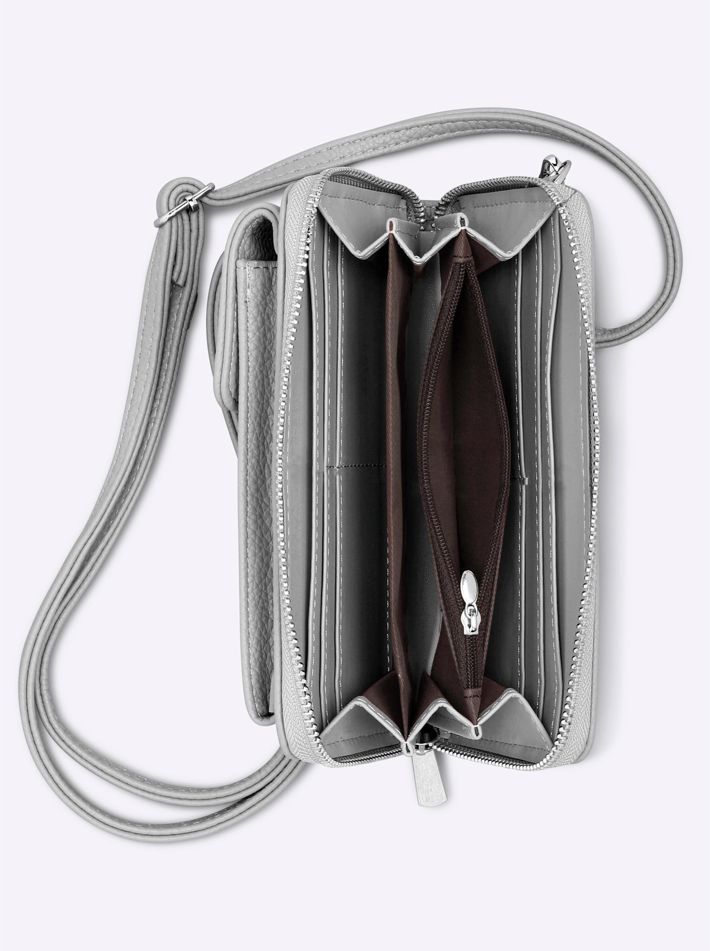 IDEAL günstig Kaufen-Handy-Tasche in silberfarben von heine. Handy-Tasche in silberfarben von heine <![CDATA[Handy-Tasche aus weichem Leder-Imitat. Ideal für Schlüssel, Handy und Portemonnaie. Vorne aufgesetztes Handyfach mit Druckknopfverschluss. Abnehmbarer und längenver