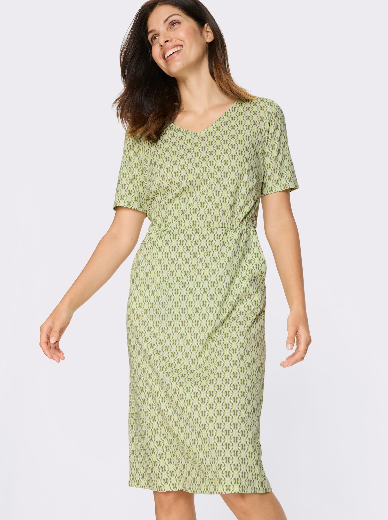 Jerseyjurk met zakken - pistache/kaki bedrukt