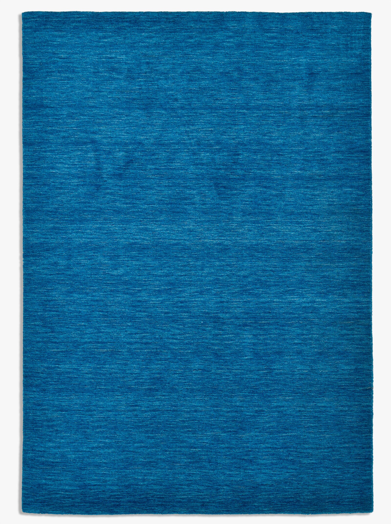 Theko Handwebteppich - blau