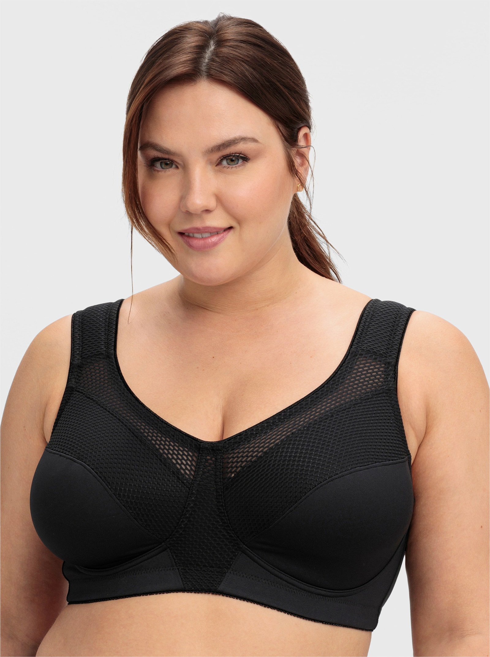 sheego Sportbeha zonder beugel met netinzetten - zwart