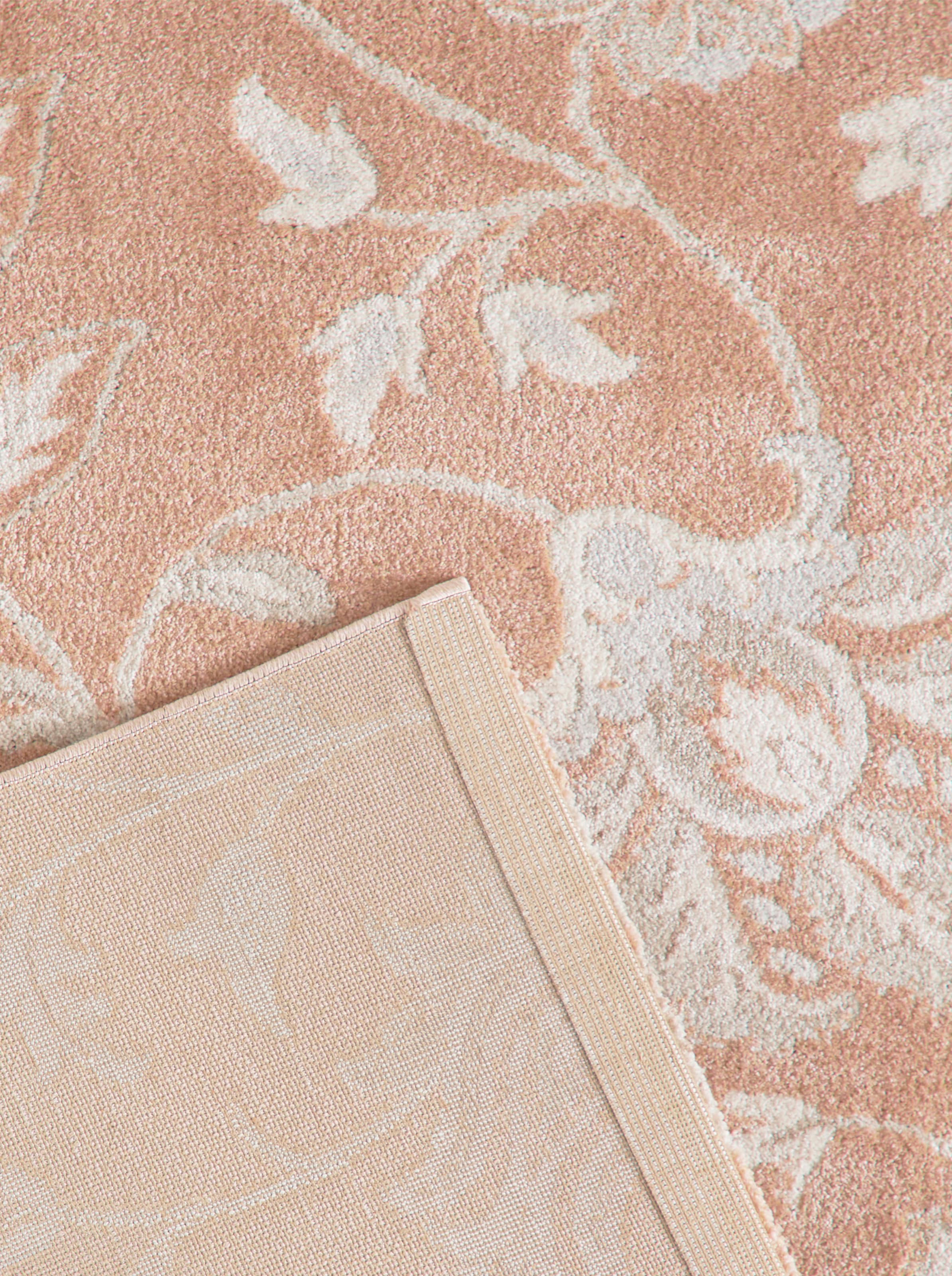 HOME günstig Kaufen-Teppich in apricot-gemustert von heine home. Teppich in apricot-gemustert von heine home <![CDATA[Teppich Made in Europe. Aufwendiges Blüten- und Rankmuster mit liebevollen Details. Maschinell gewebt. Längsseiten gekettelt. Pflegeleicht. Wasserabweisend