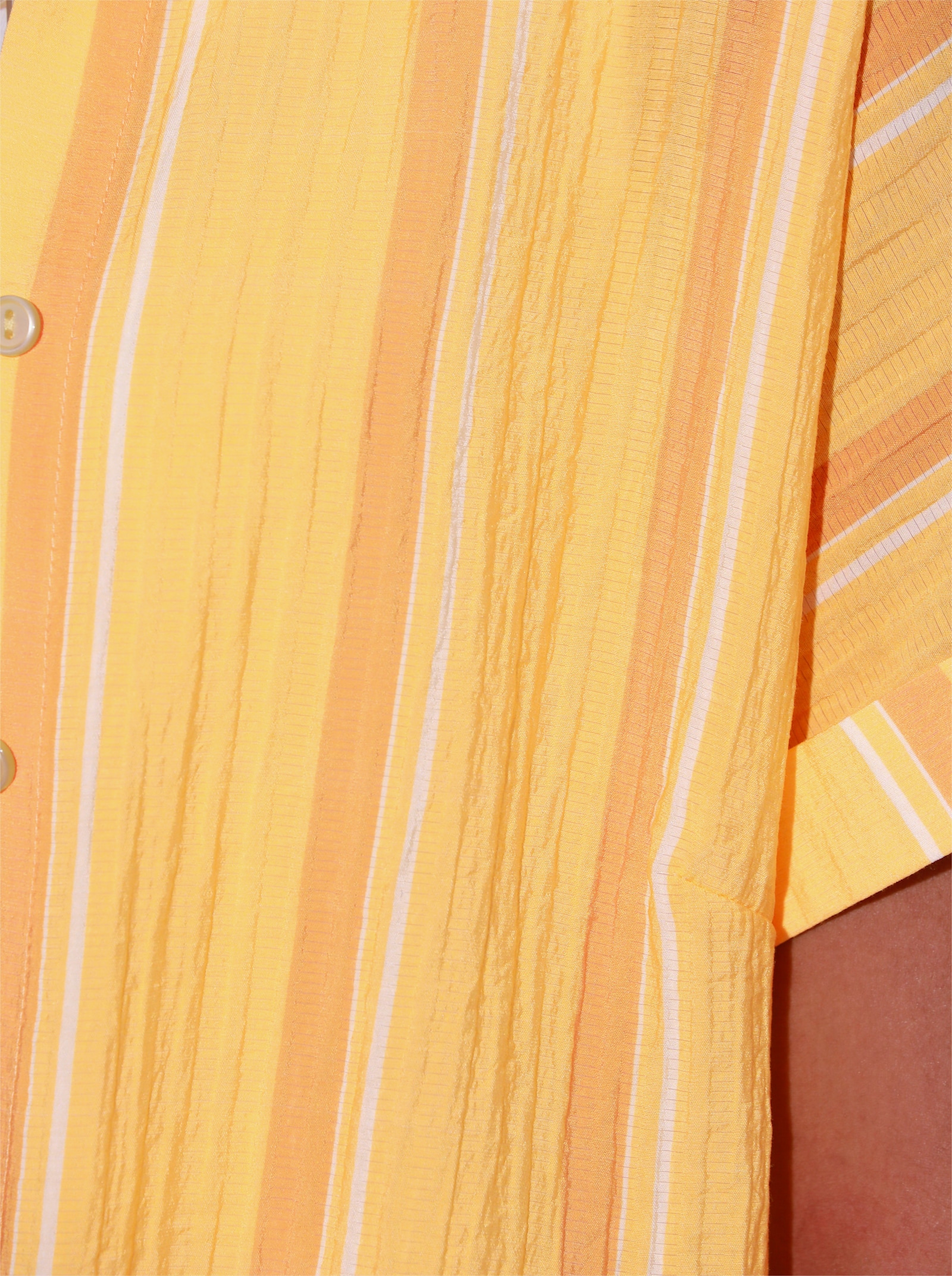 Lange blouse met stolpplooi op de rug - geel/oker gestreept