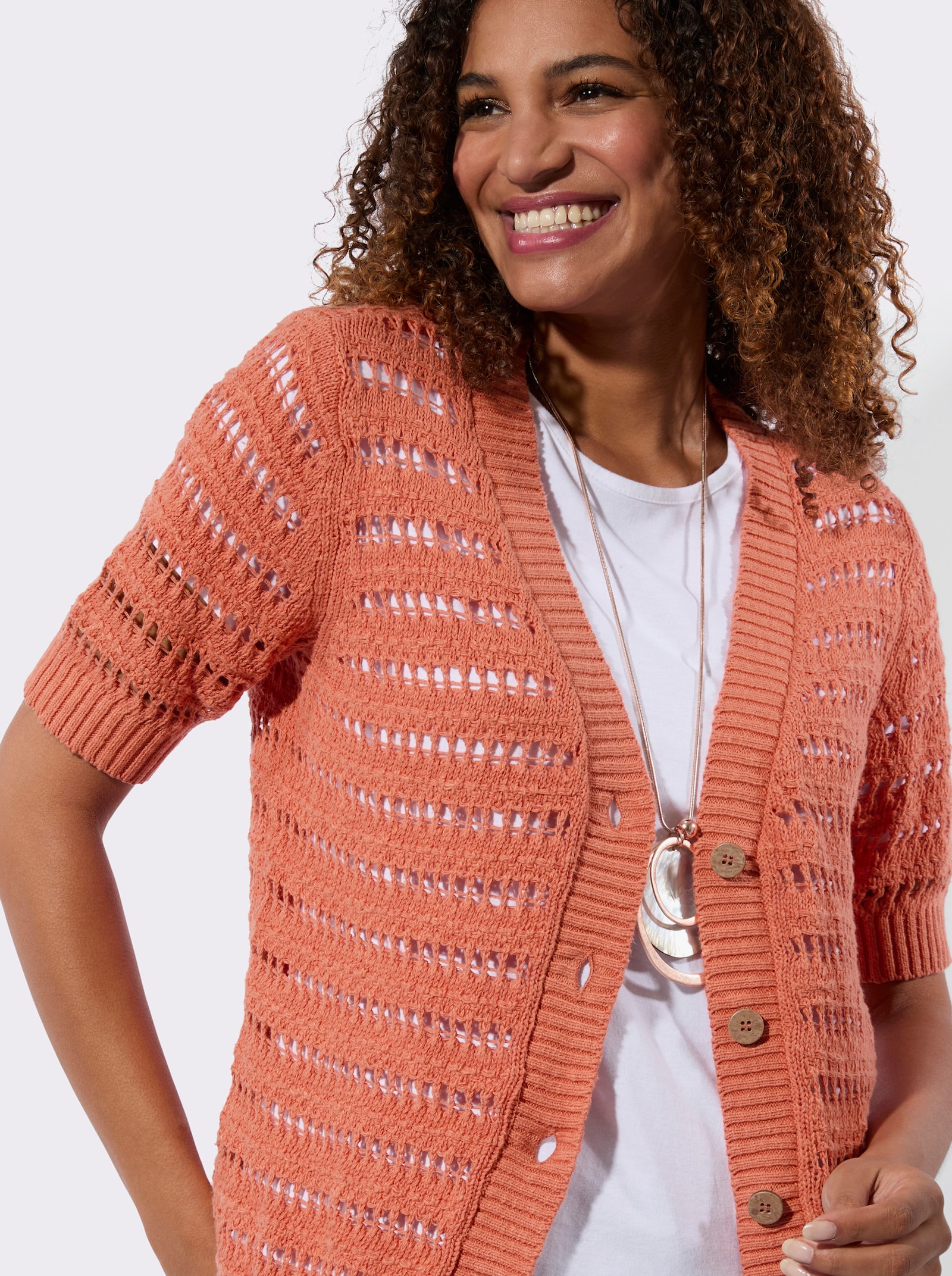 Ajourstrickjacke mit Bouclé Struktur - papaya