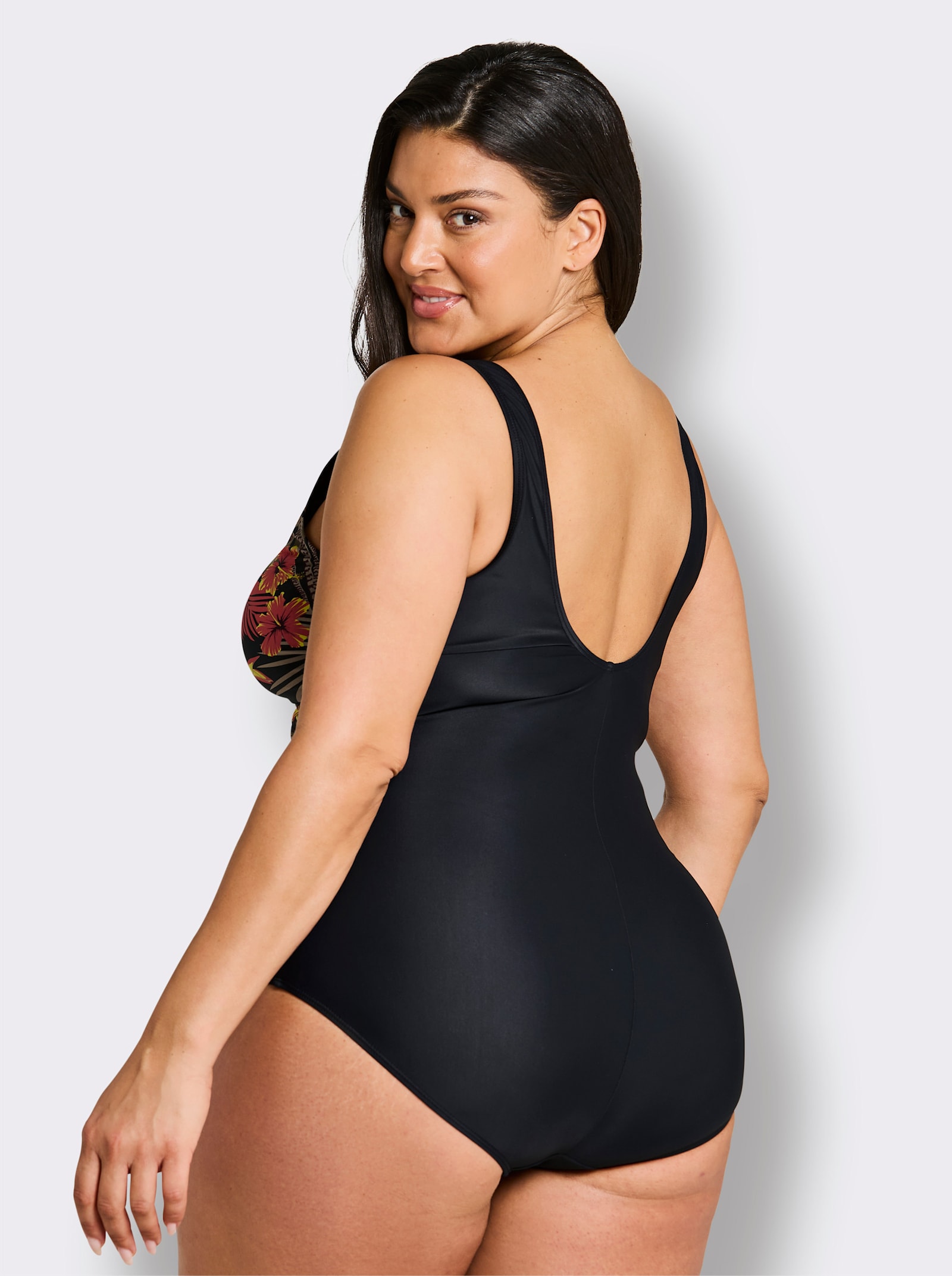 sheego Badeanzug mit tropischem Print - schwarz-burgund-bedruckt