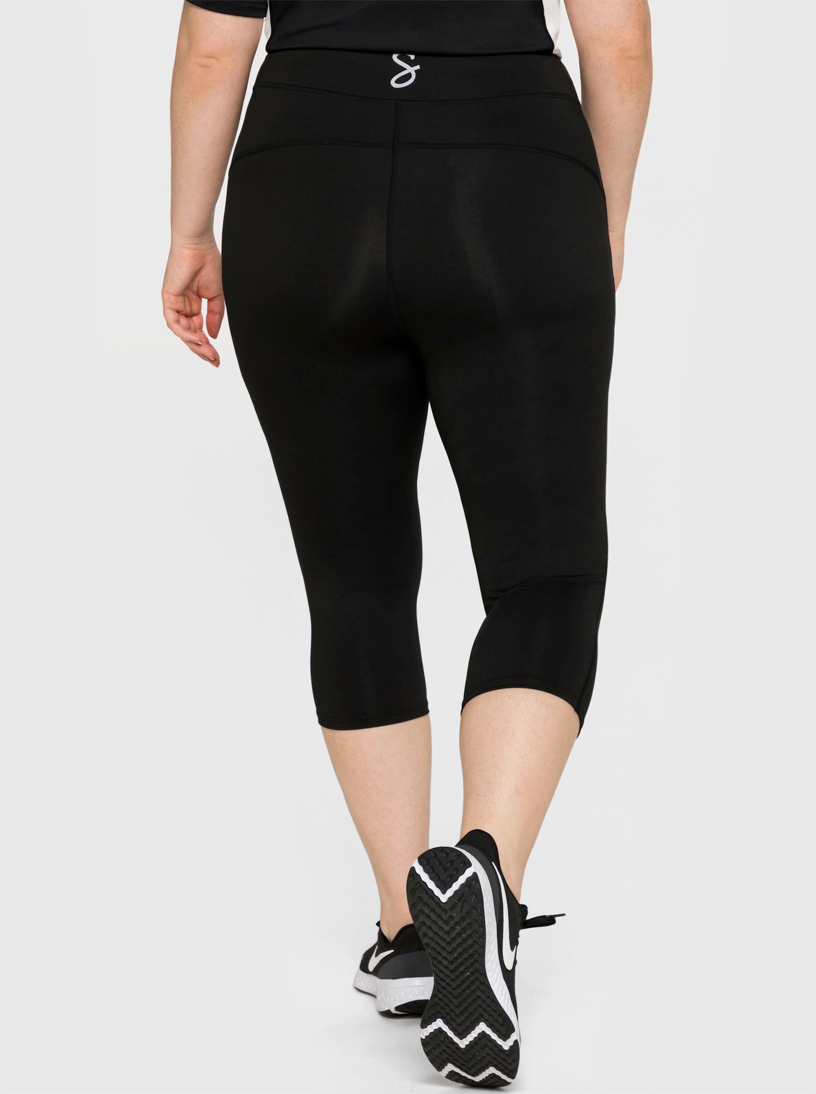 sheego Functionele tight in caprilengte - zwart