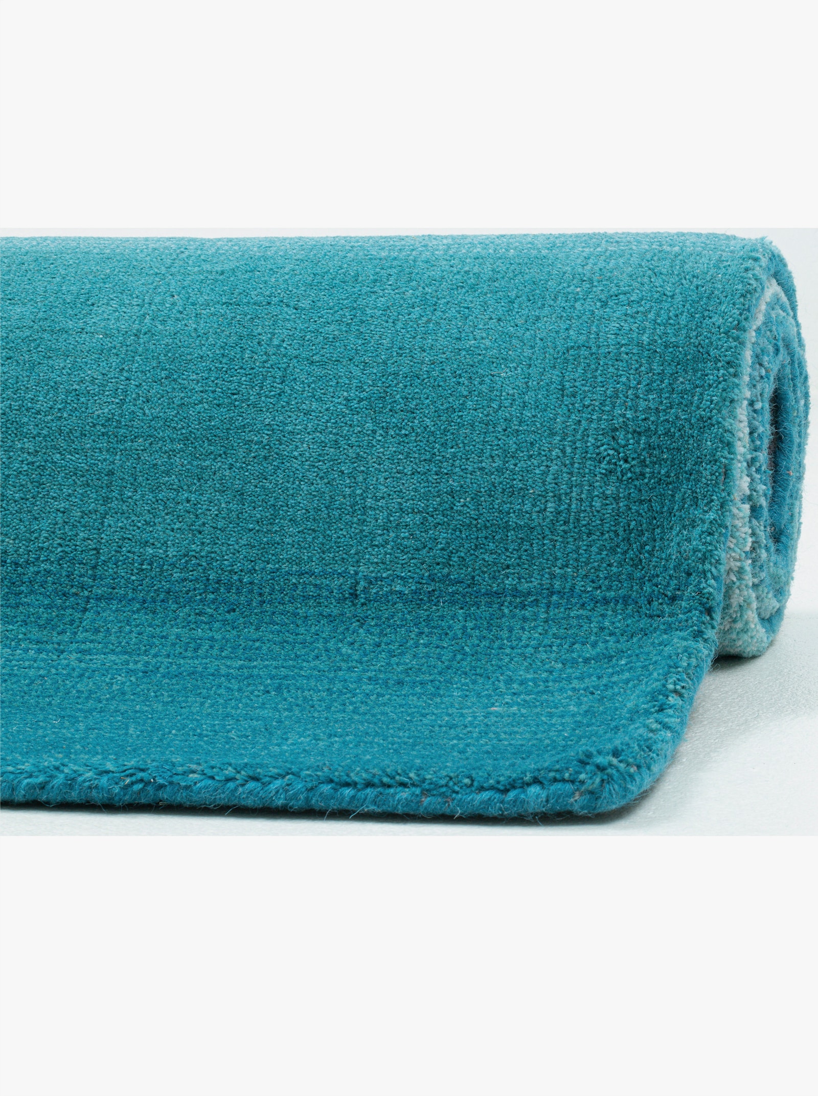 Theko Handwebteppich - türkis