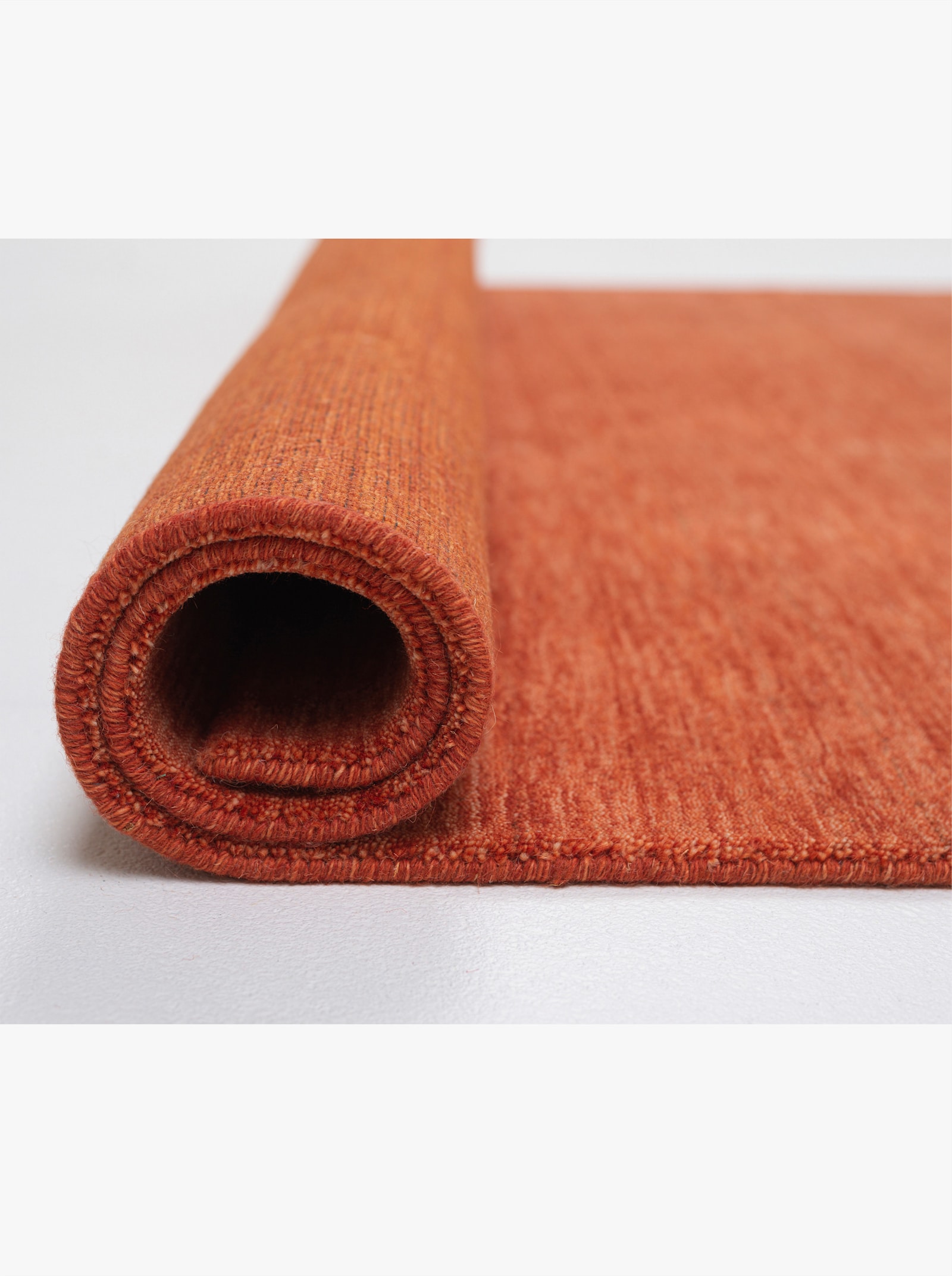 Theko Handwebteppich - orange