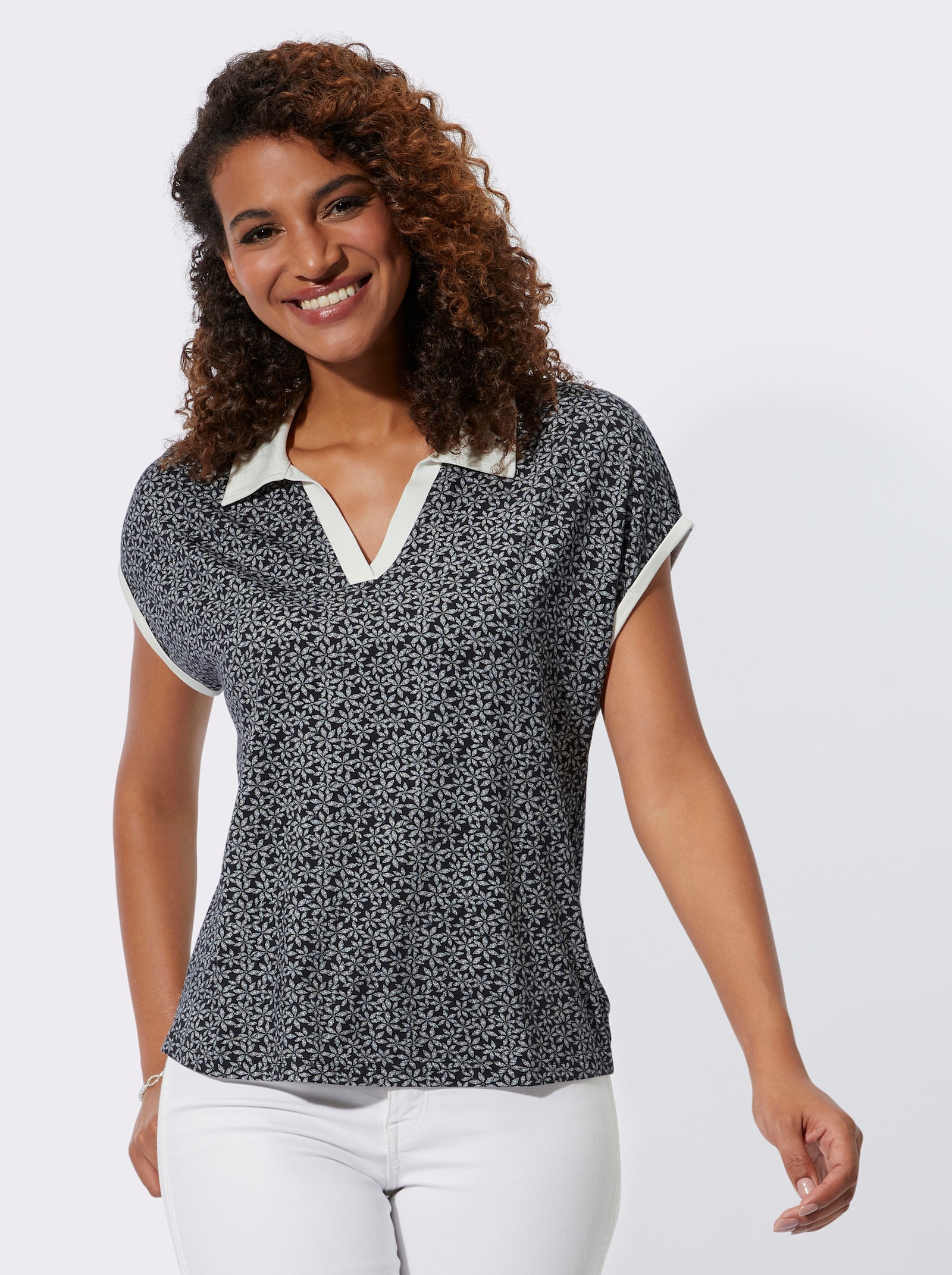 Poloshirt met bloemenprint - zwart/wit geprint