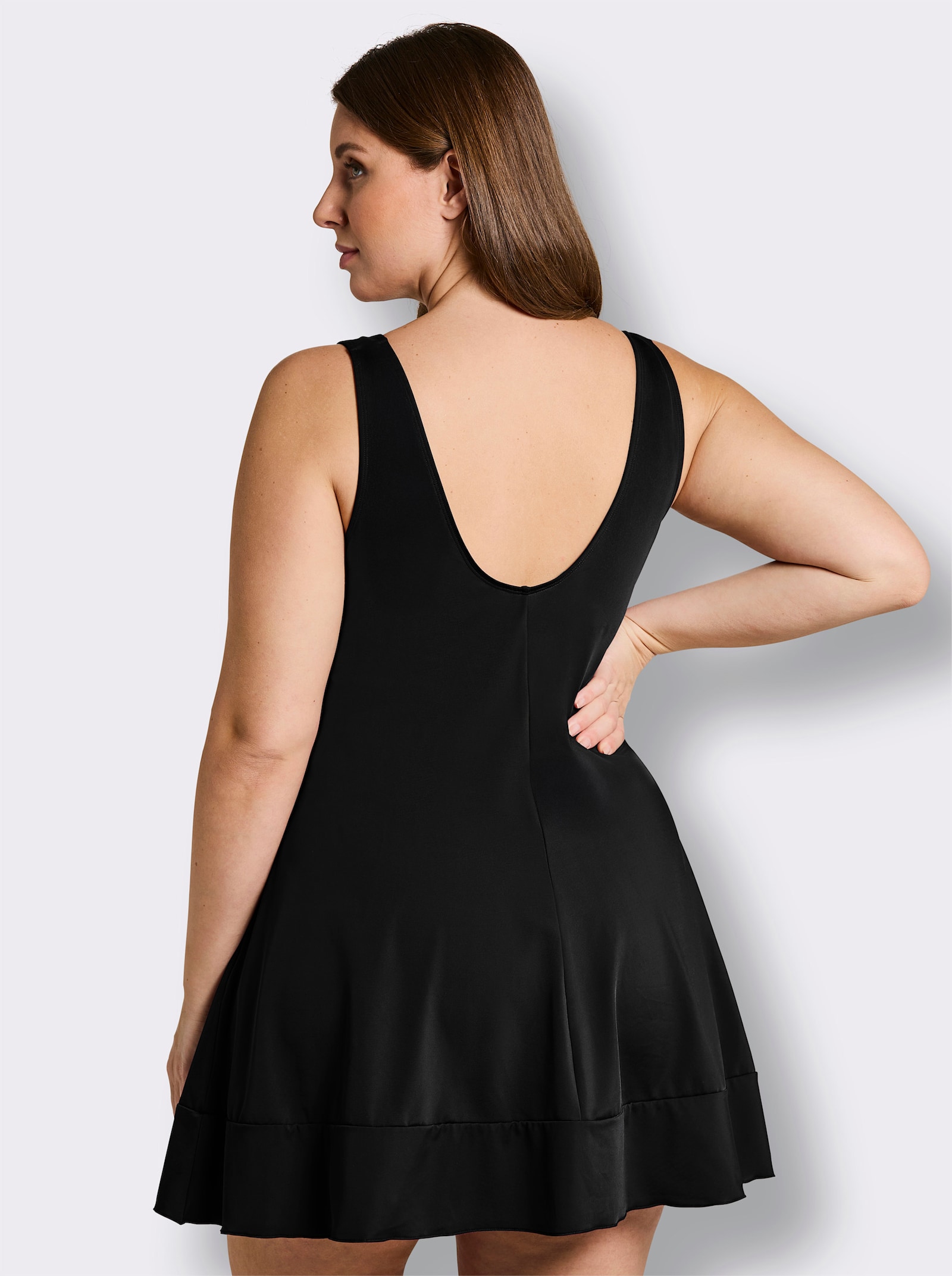 sheego Badekleid mit Raffung am Saum - schwarz