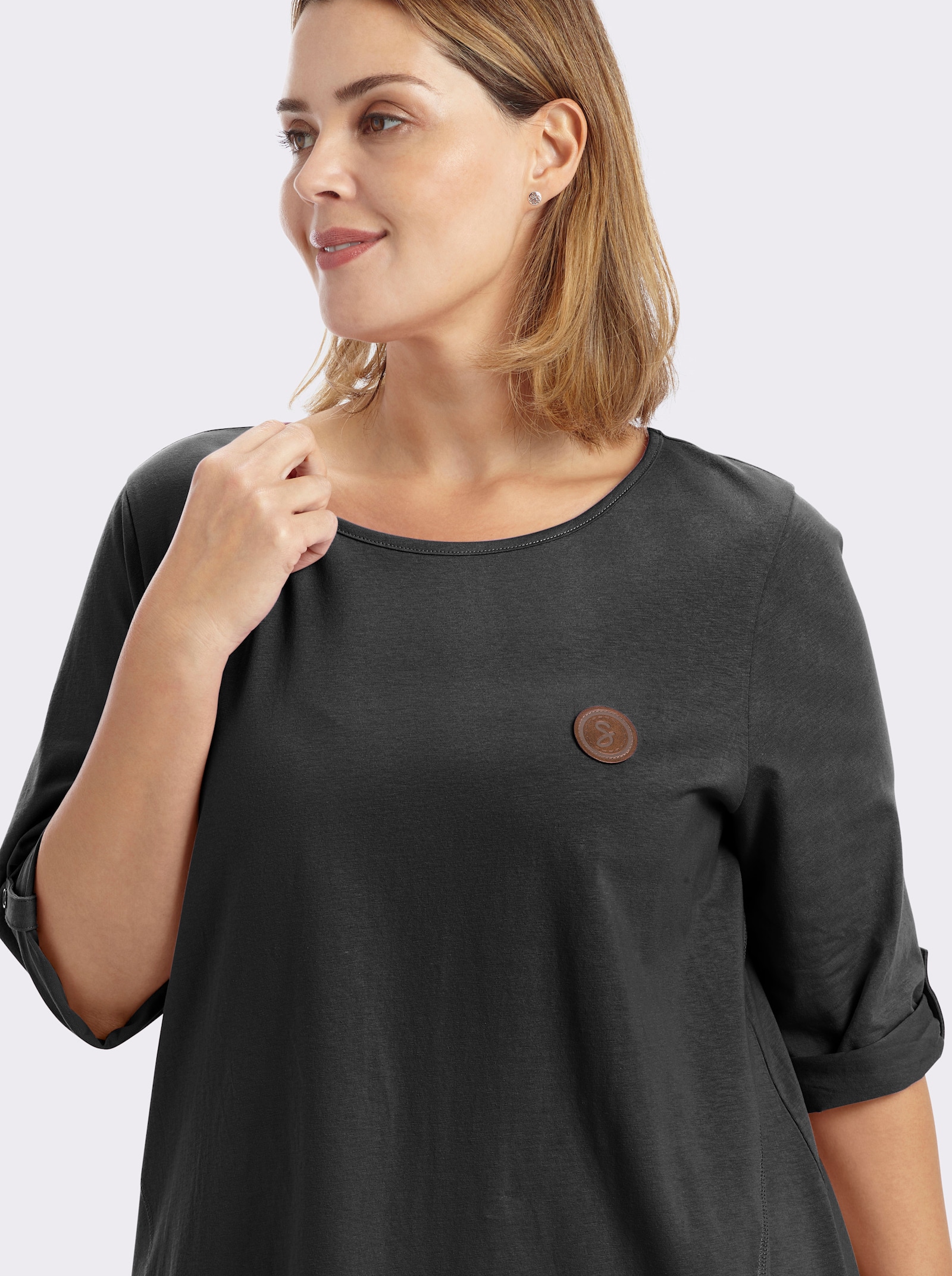 sheego Longshirt in kaschierender A-Linie - schwarz