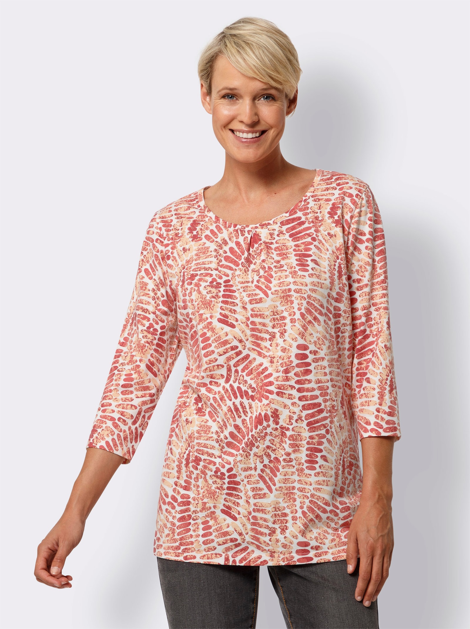 Lång topp med motveck fram - ecru-aprikos, med tryck