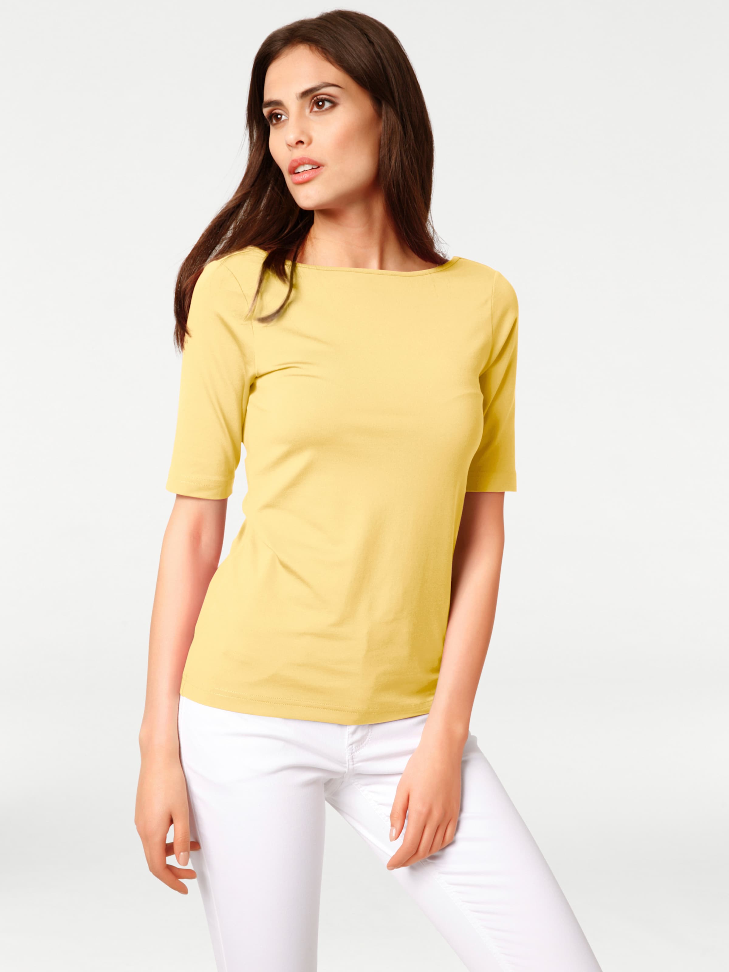 Figur von günstig Kaufen-U-Boot-Shirt in gelb von heine. U-Boot-Shirt in gelb von heine <![CDATA[U-Boot Shirt Reizvoll: der tiefe V-Ausschnitt im Rücken. Figurbetont, mit Kurzarm. Angenehm weiche, farbbrillante Stretch-Qualität mit leichtem Glanz.]]>. 