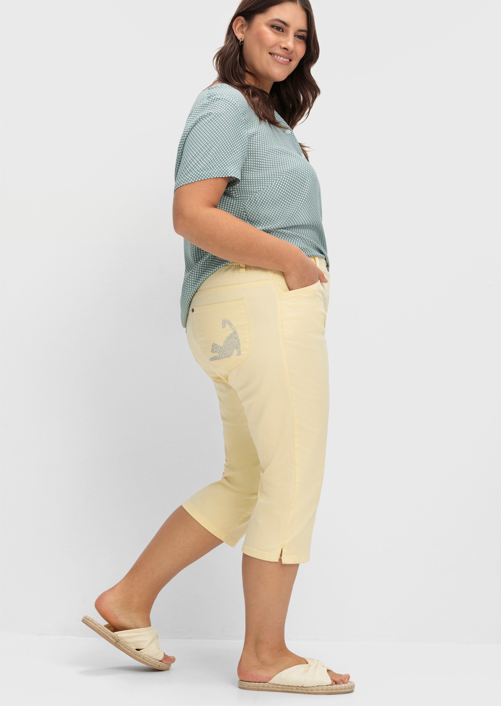 Caprijeans mit glitzerndem Katzenmotiv - vanillegelb