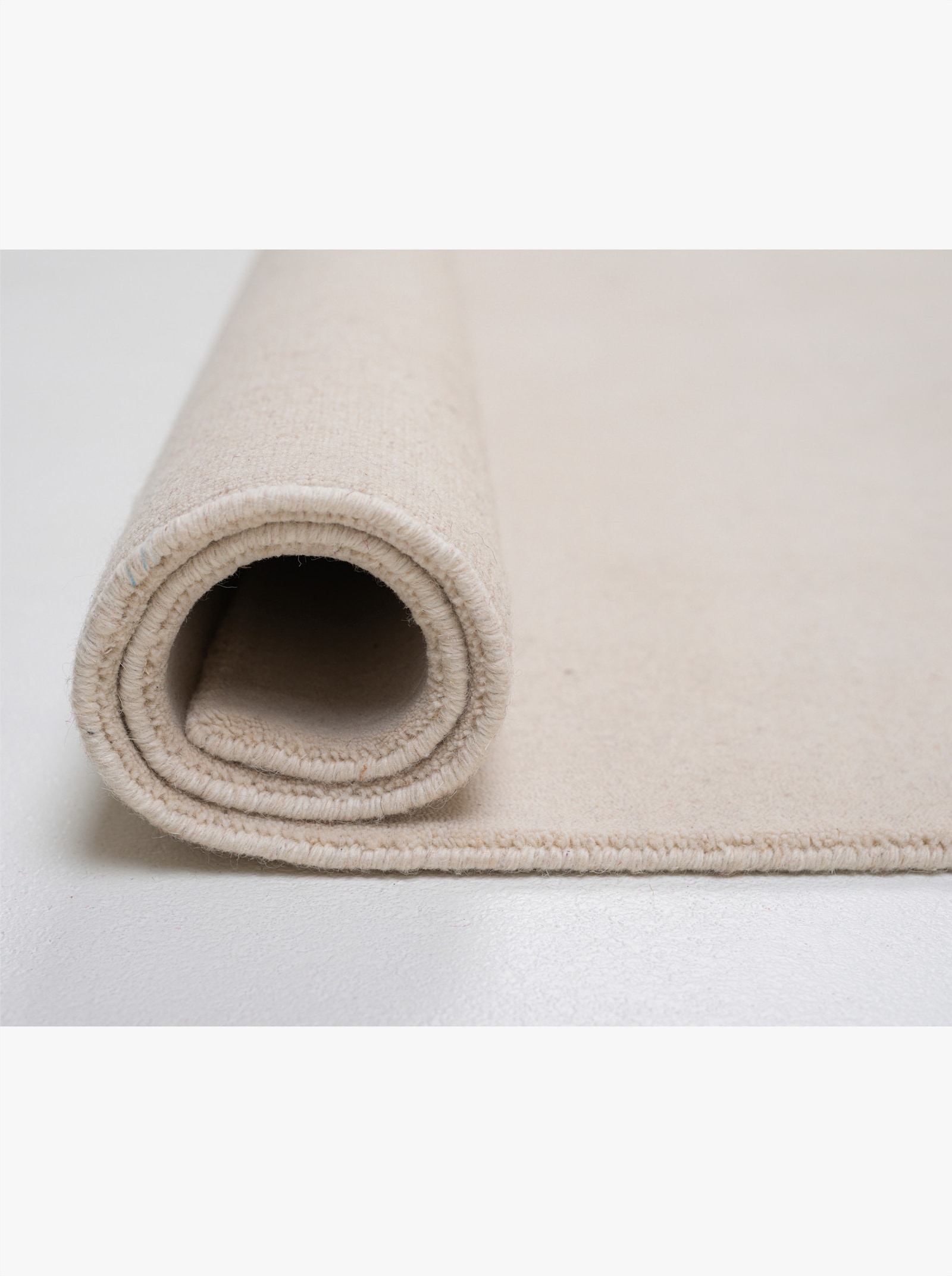 Theko Handwebteppich - wollweiß