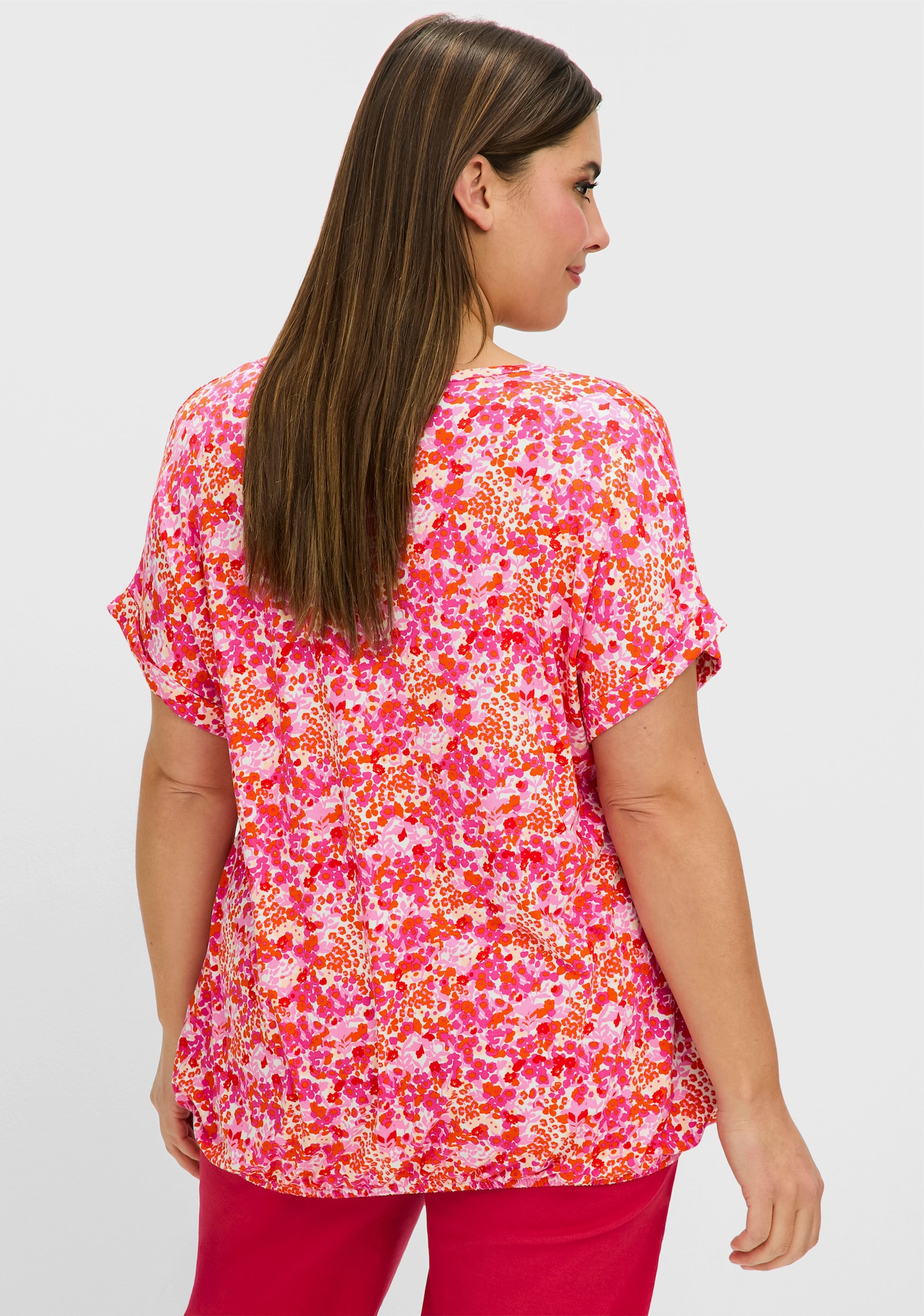 sheego T-Shirt mit Blumendruck und Saum-Gummizug - fuchsia-gemustert