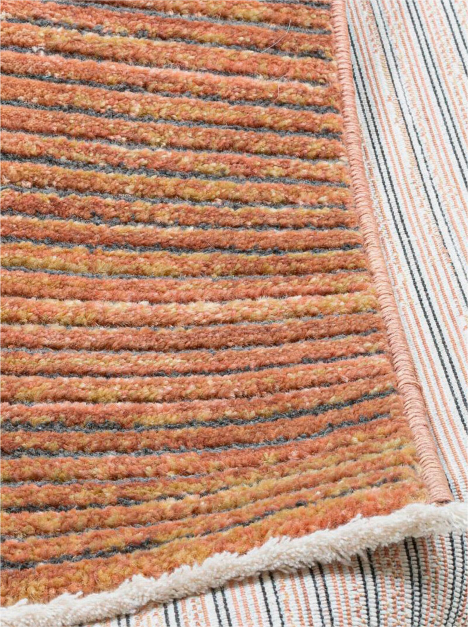 Theko Teppich - rost-meliert