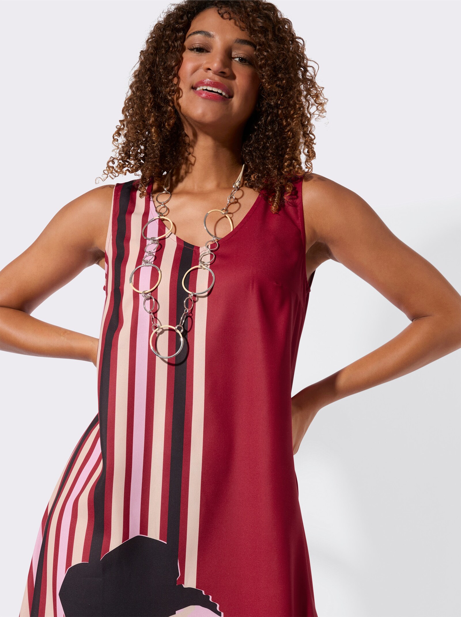 Druckkleid in ausgestellter A-Form - rot-rosé-bedruckt
