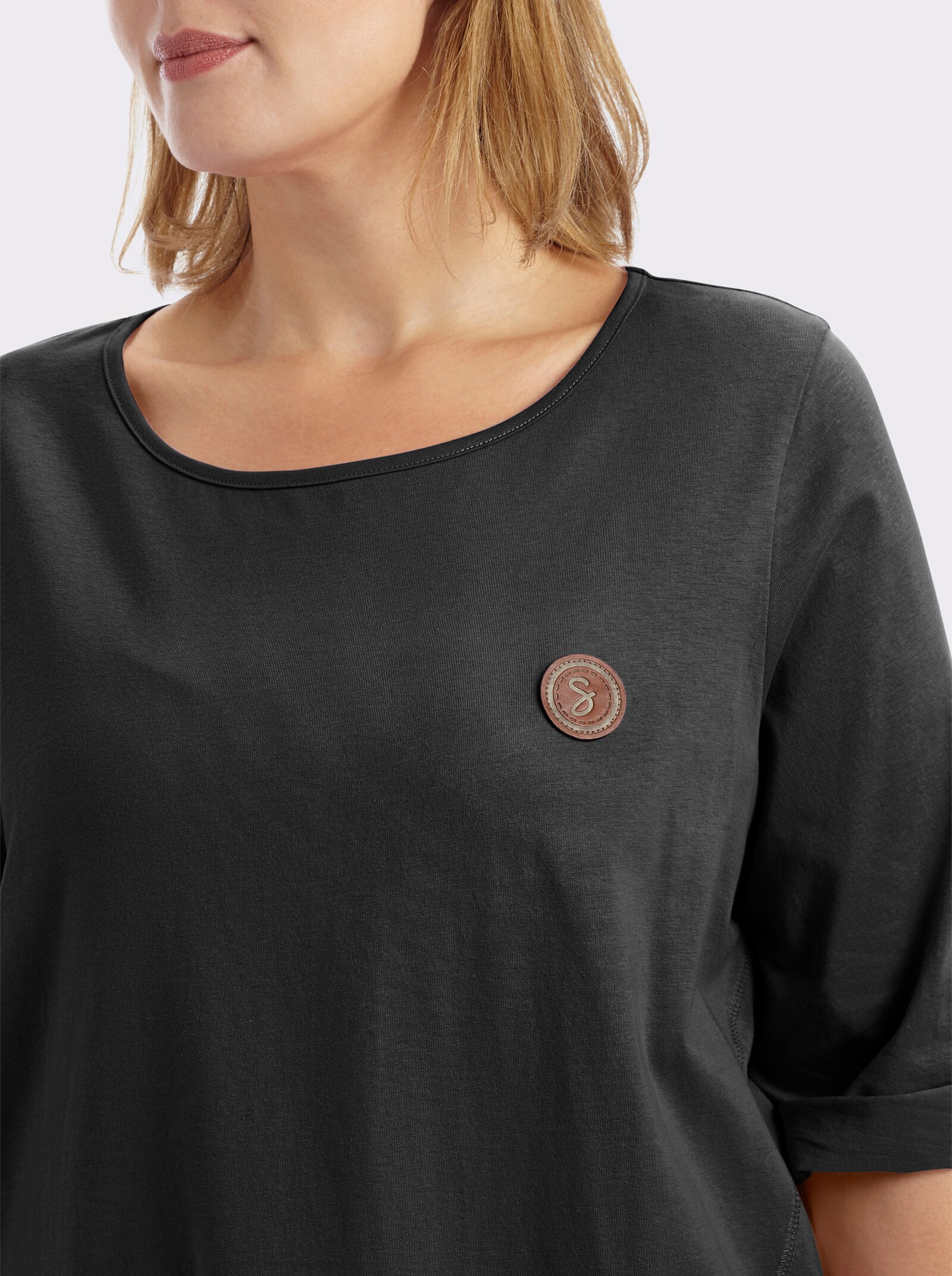 sheego Longshirt in kaschierender A-Linie - schwarz