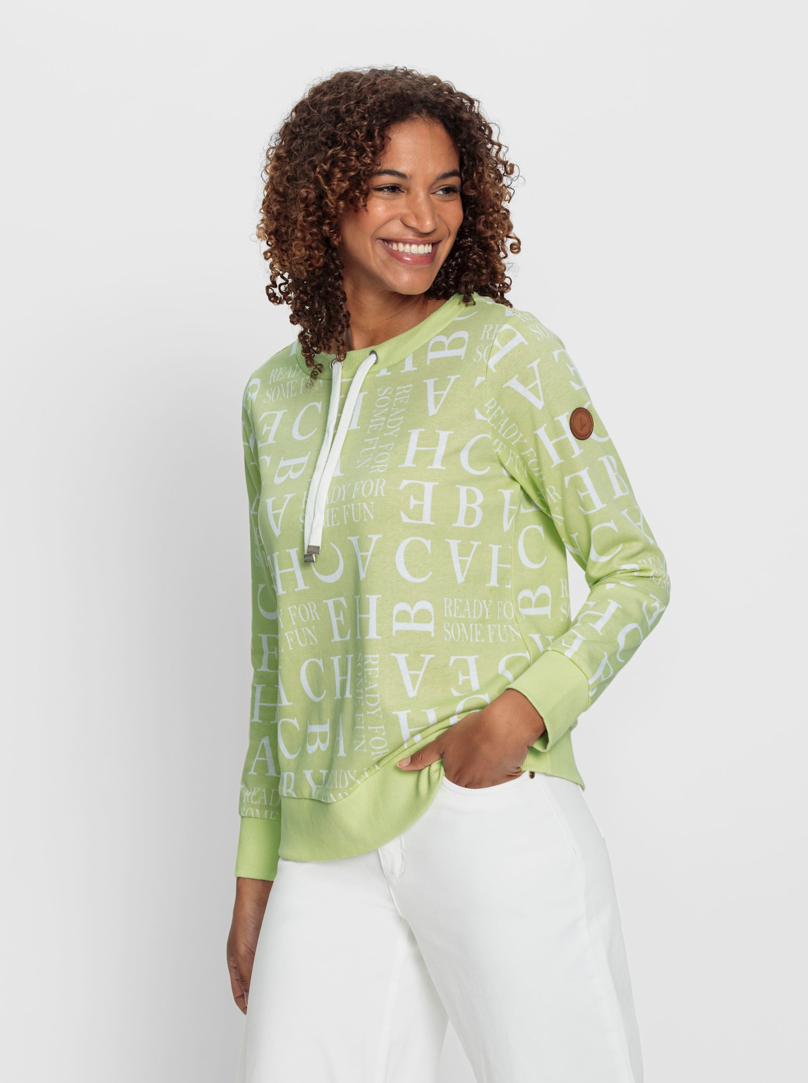 Sweatshirt mit Kordeldurchzug am Ausschnitt - pistazie-ecru-bedruckt