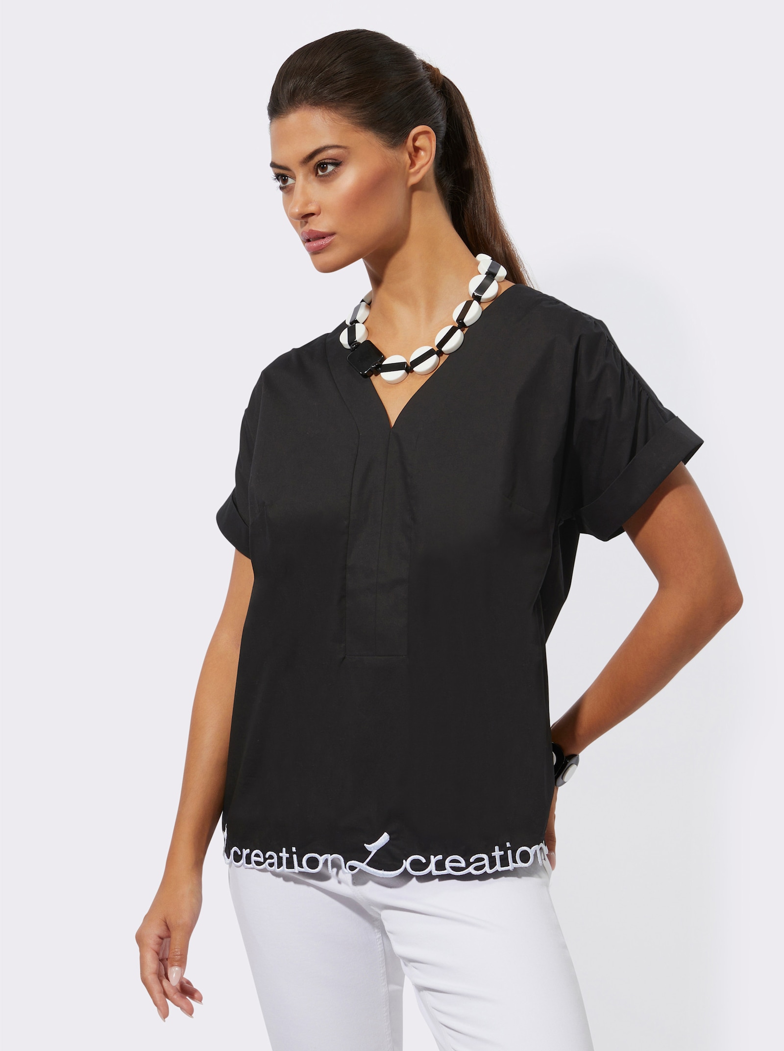 Baumwollbluse mit gesticktem Schriftzug - schwarz