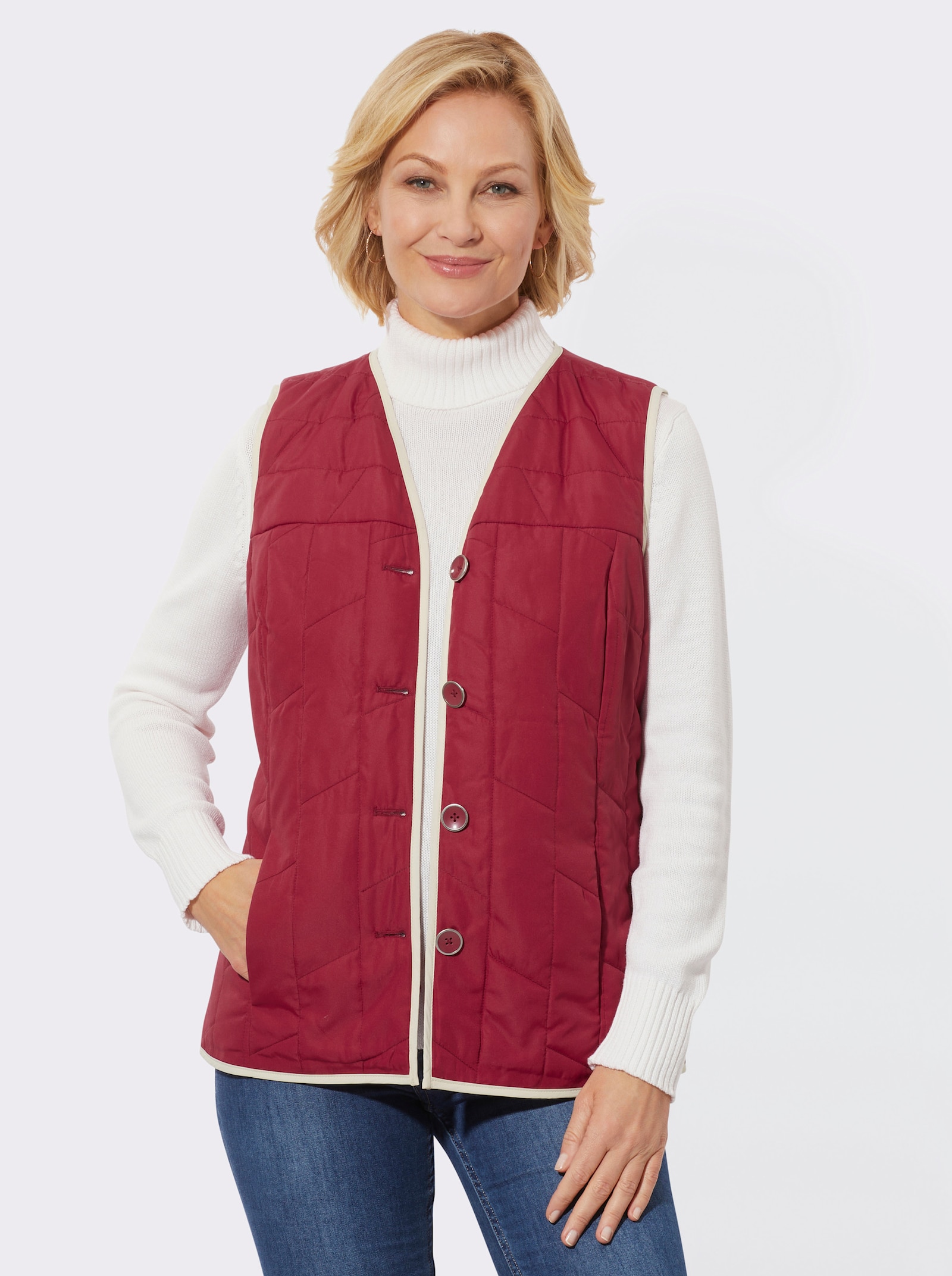 Bodywarmer met contrastkleurige paspels - kers