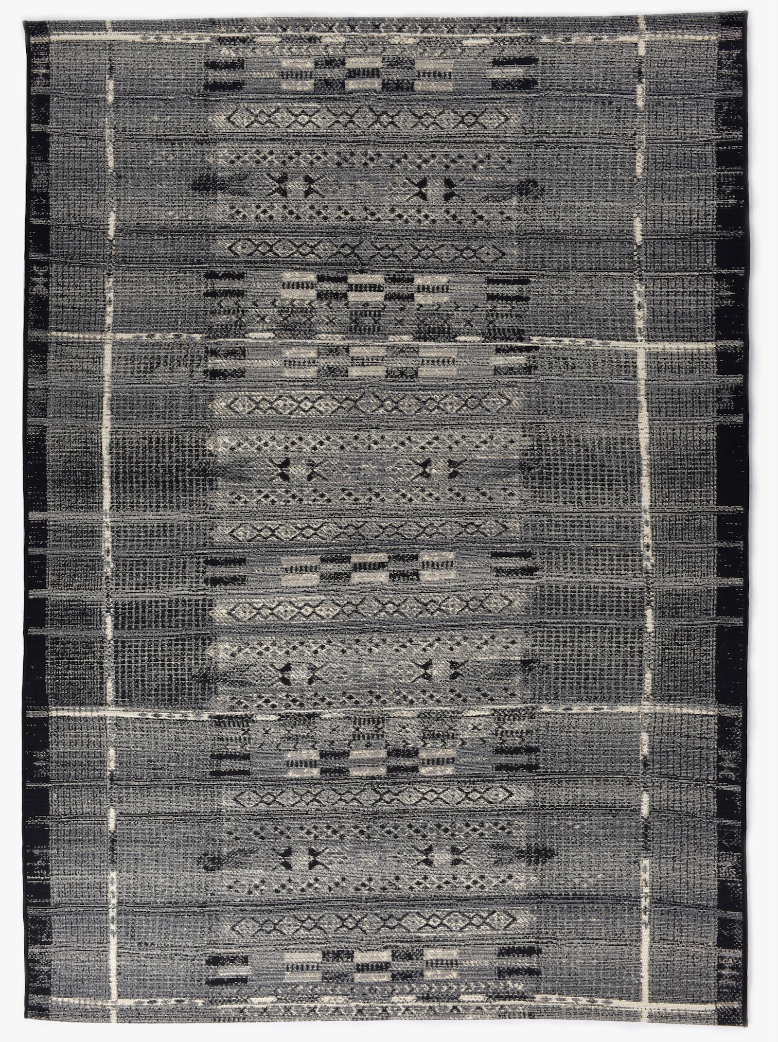 Theko Teppich - grau