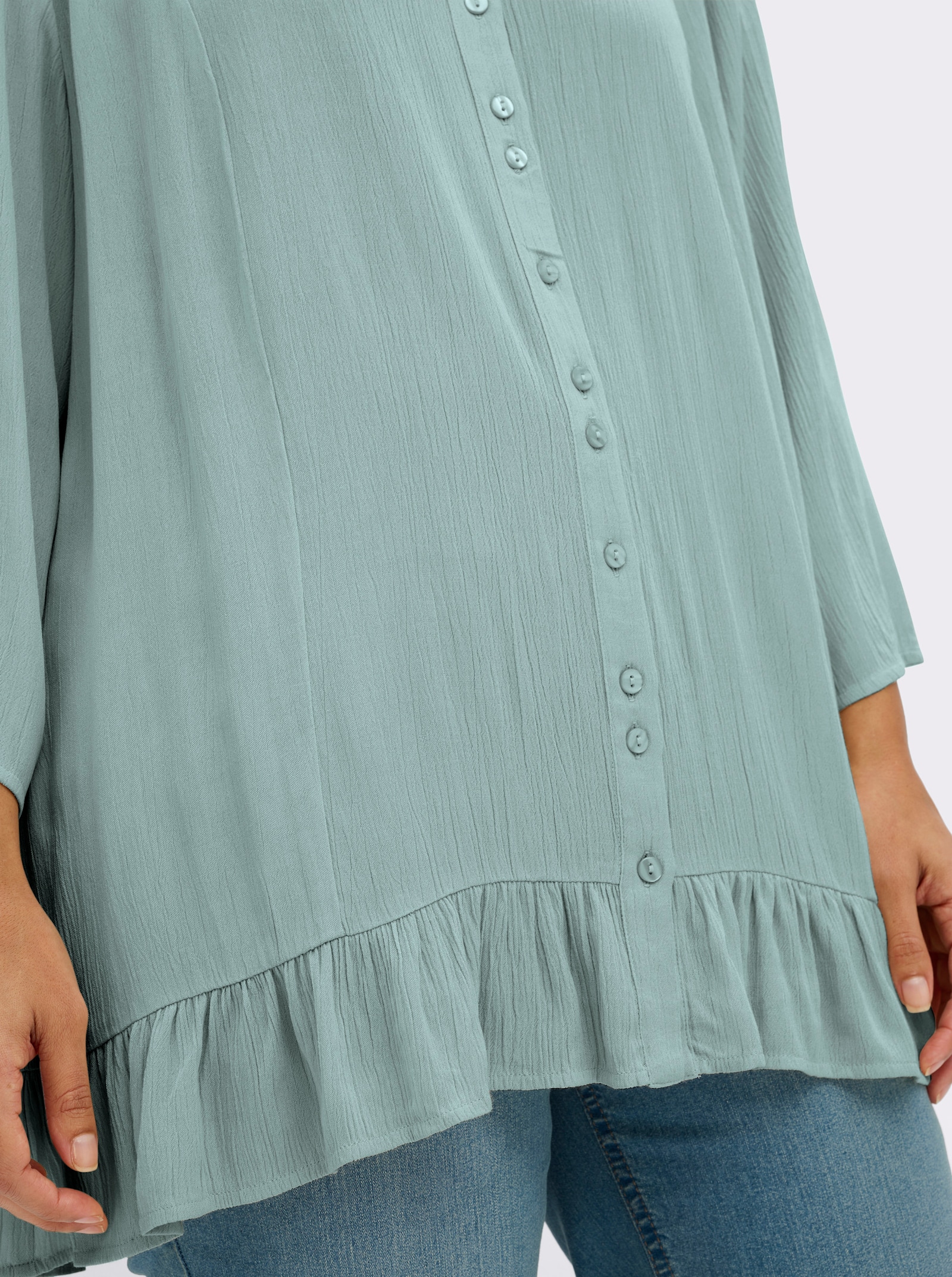 sheego Crinklebluse mit Volant am Saum - kalkmint