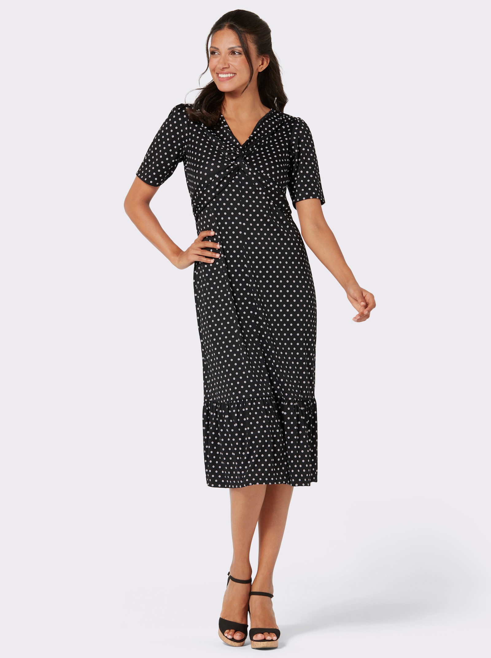 Shirtjurk met volant aan de zoom - zwart/wit gestippeld