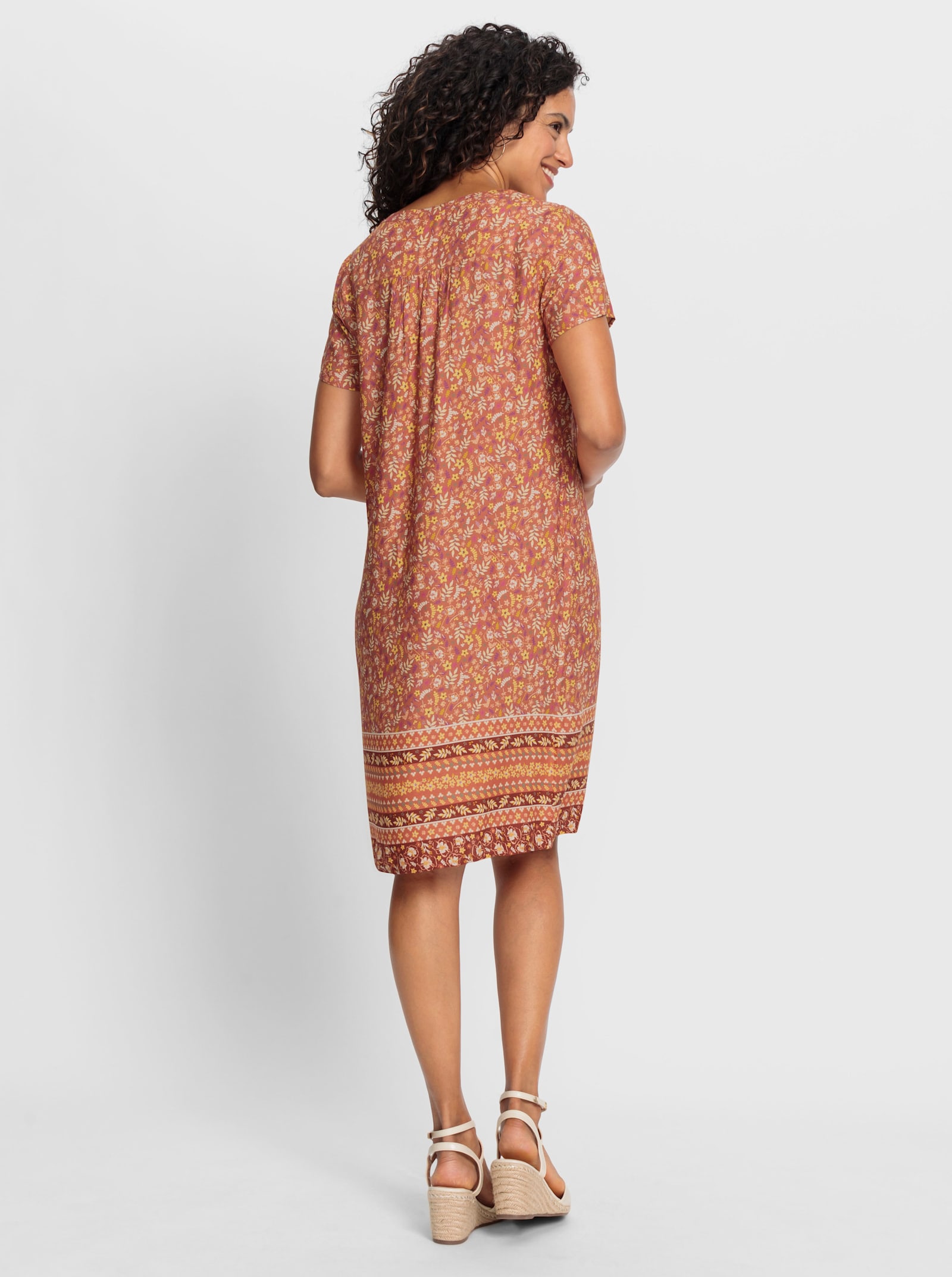 Druckkleid mit Blümchen- und Bordürenmuster - papaya-rotbraun-bedruckt