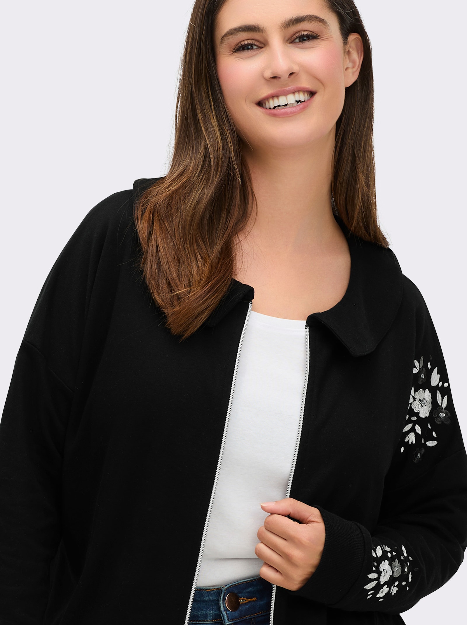 sheego Sweatjacke mit Glitzer-Blumendruck - schwarz