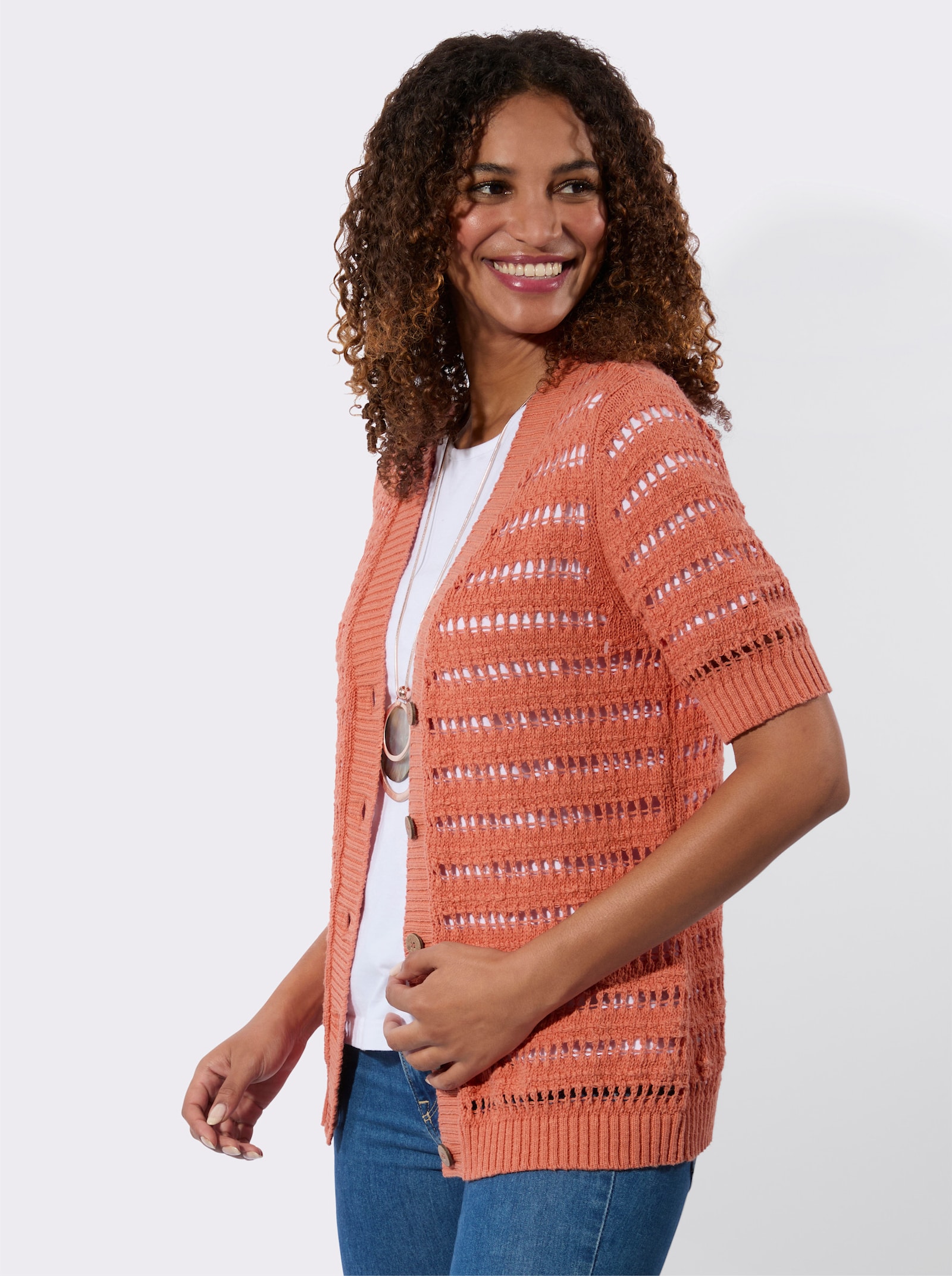 Ajourstrickjacke mit Bouclé Struktur - papaya