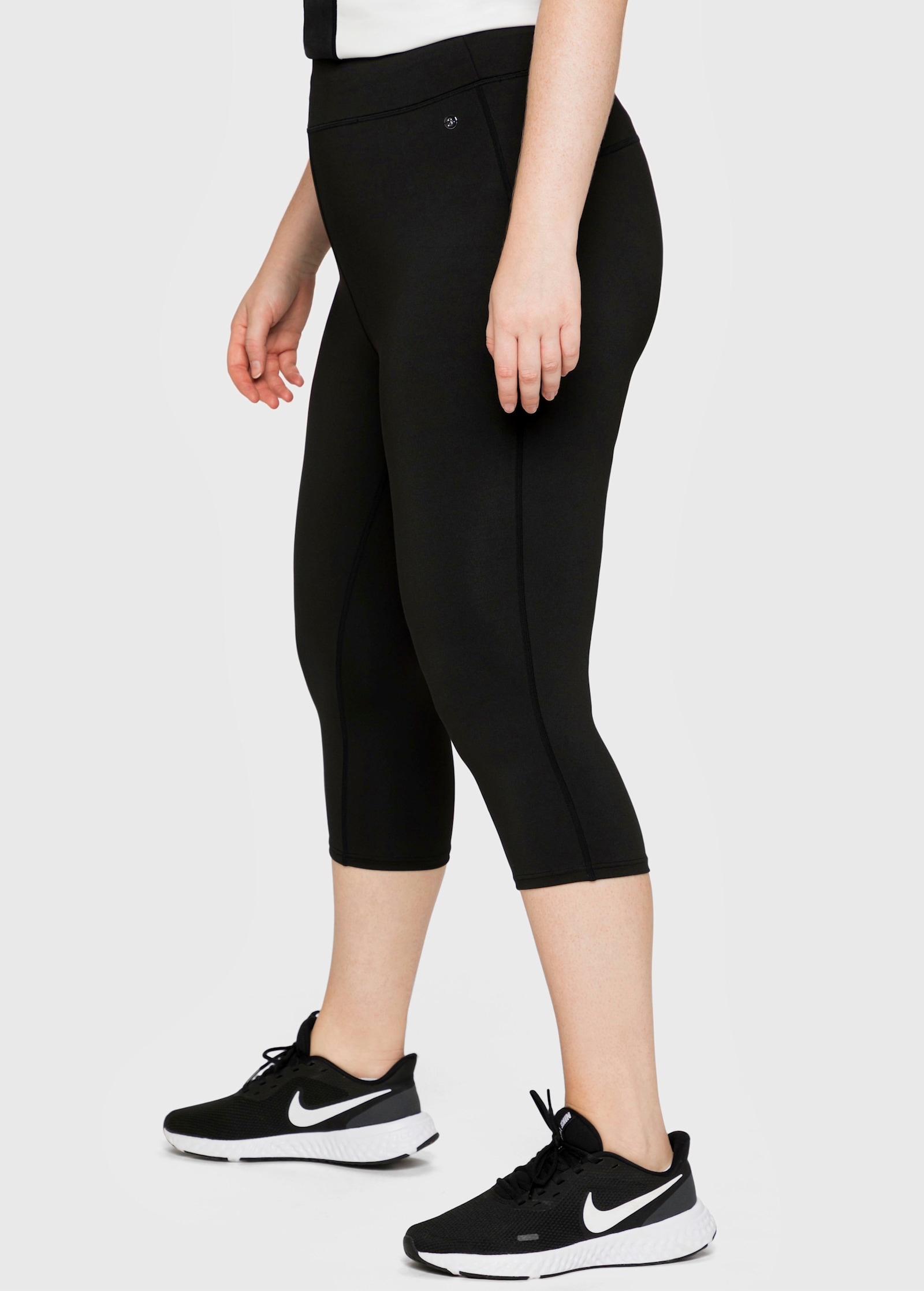 sheego Functionele tight in caprilengte - zwart