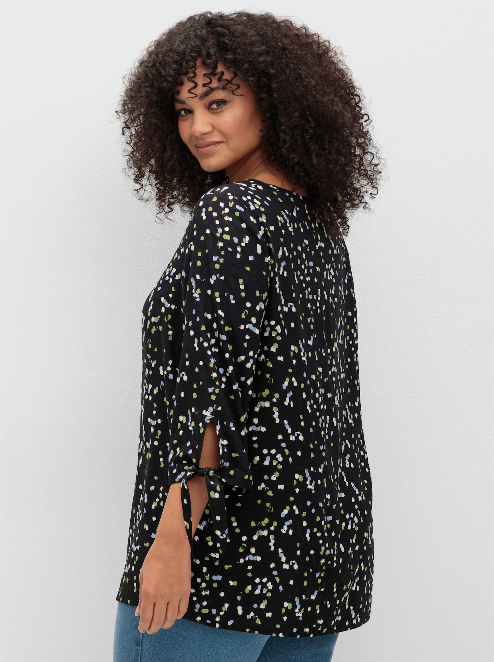 sheego Tunika mit Bindeband am Ärmel - schwarz-gemustert