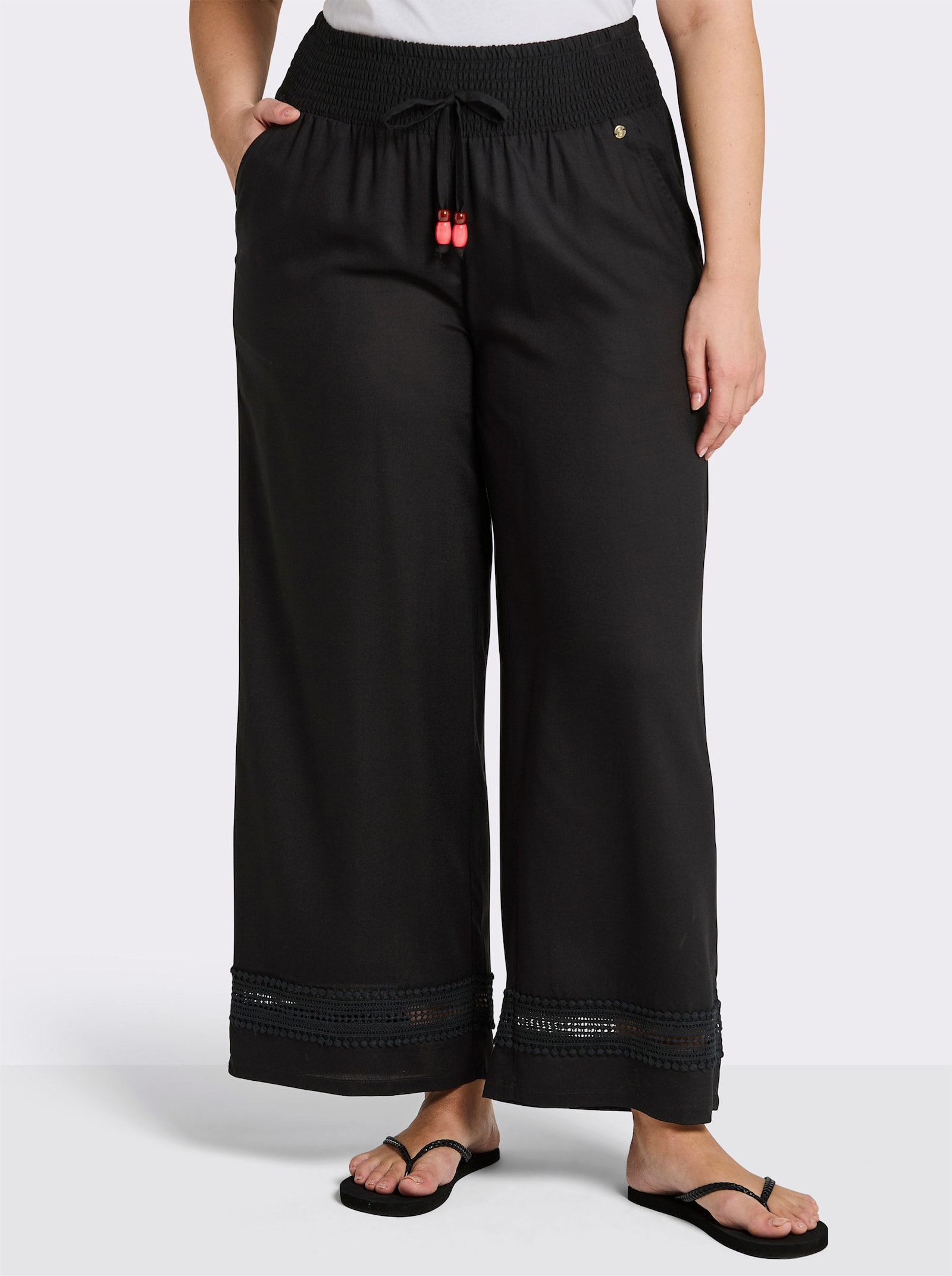 sheego Schlupfhose mit Spitze am Saum - schwarz