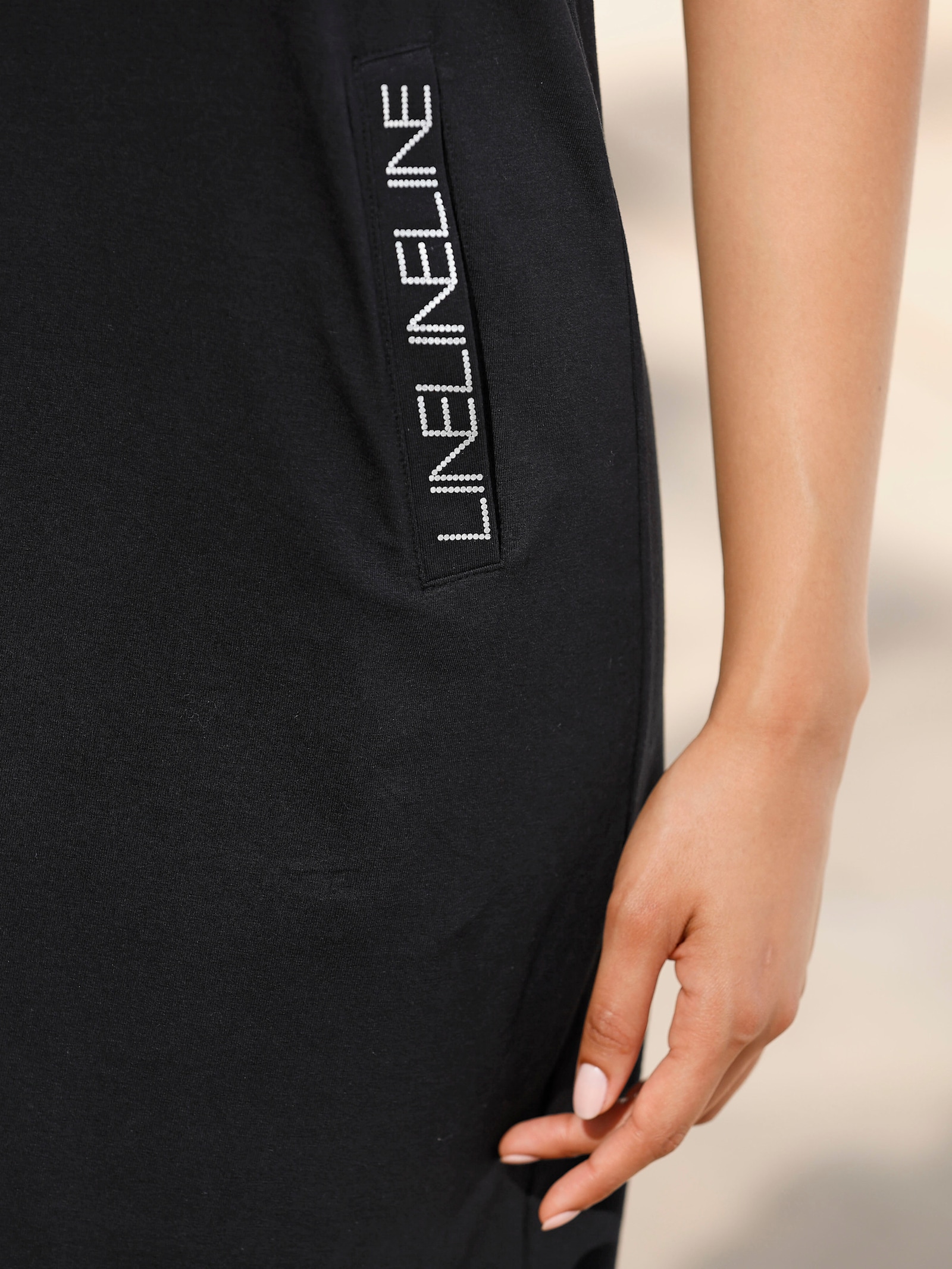 Jerseyjurk met zilverkleurige printdetails - zwart