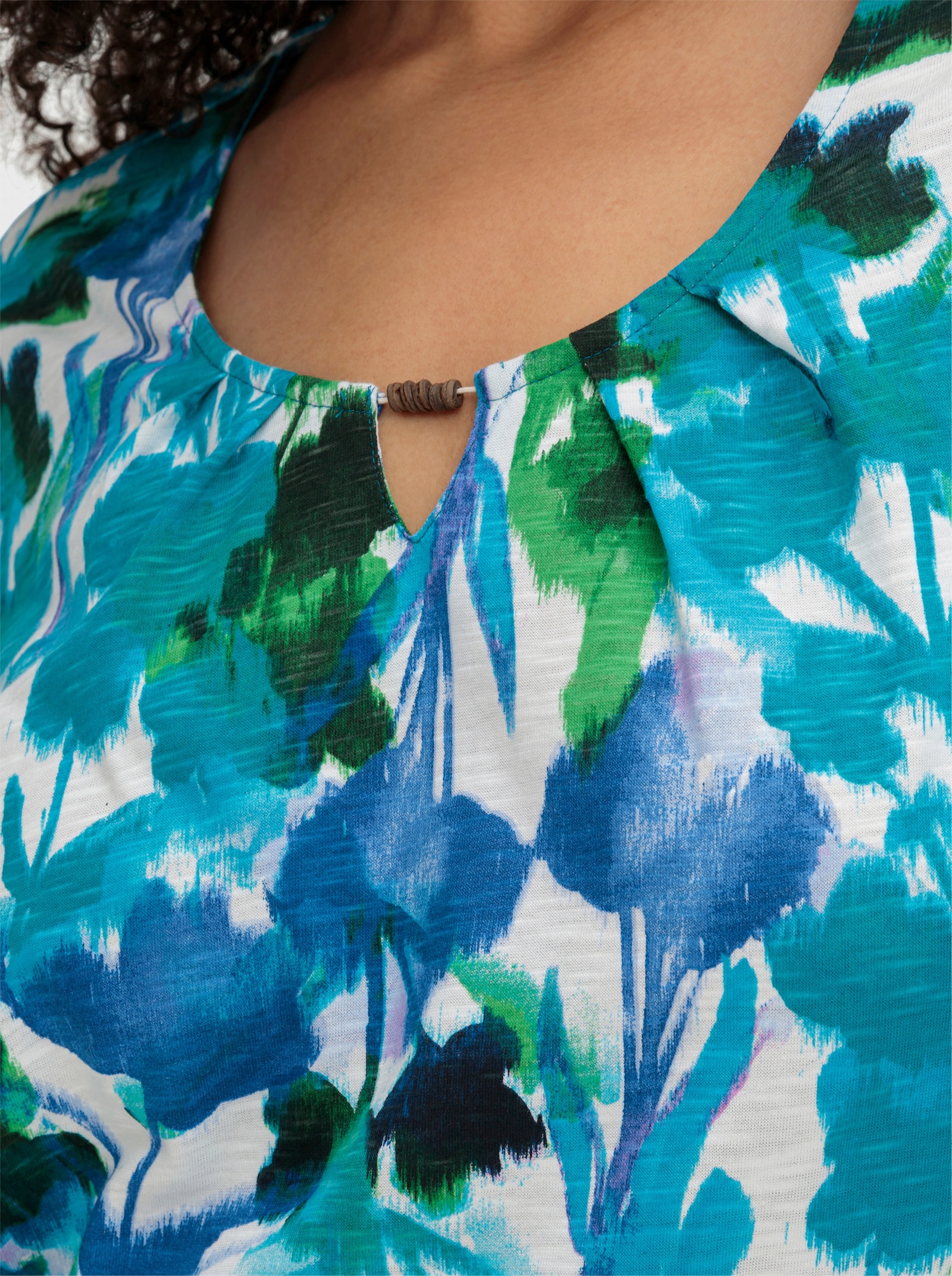 sheego Kurzarmshirt in A-Linie - türkis-gemustert