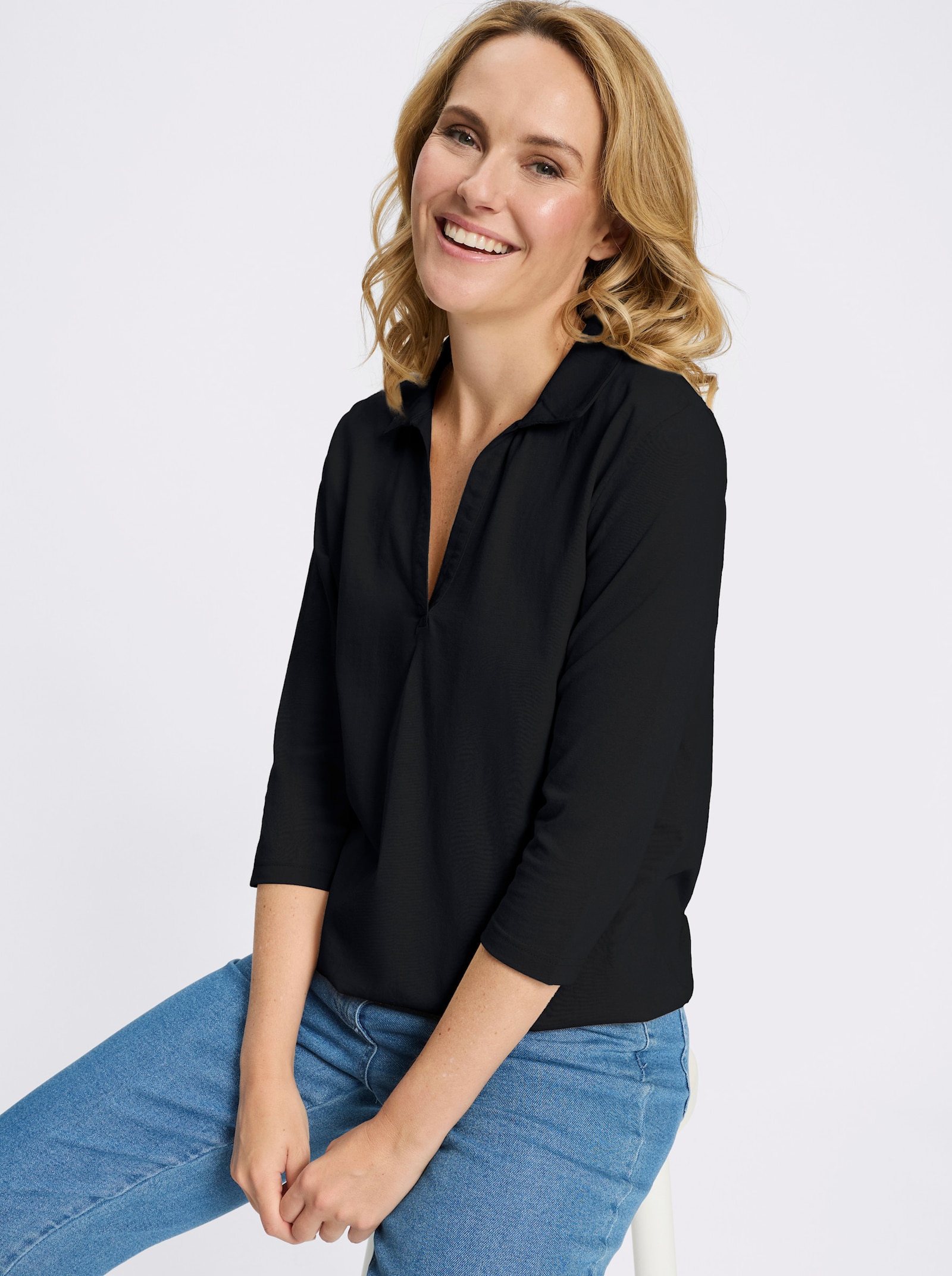 Poloshirt mit Gummizug am Saum - schwarz