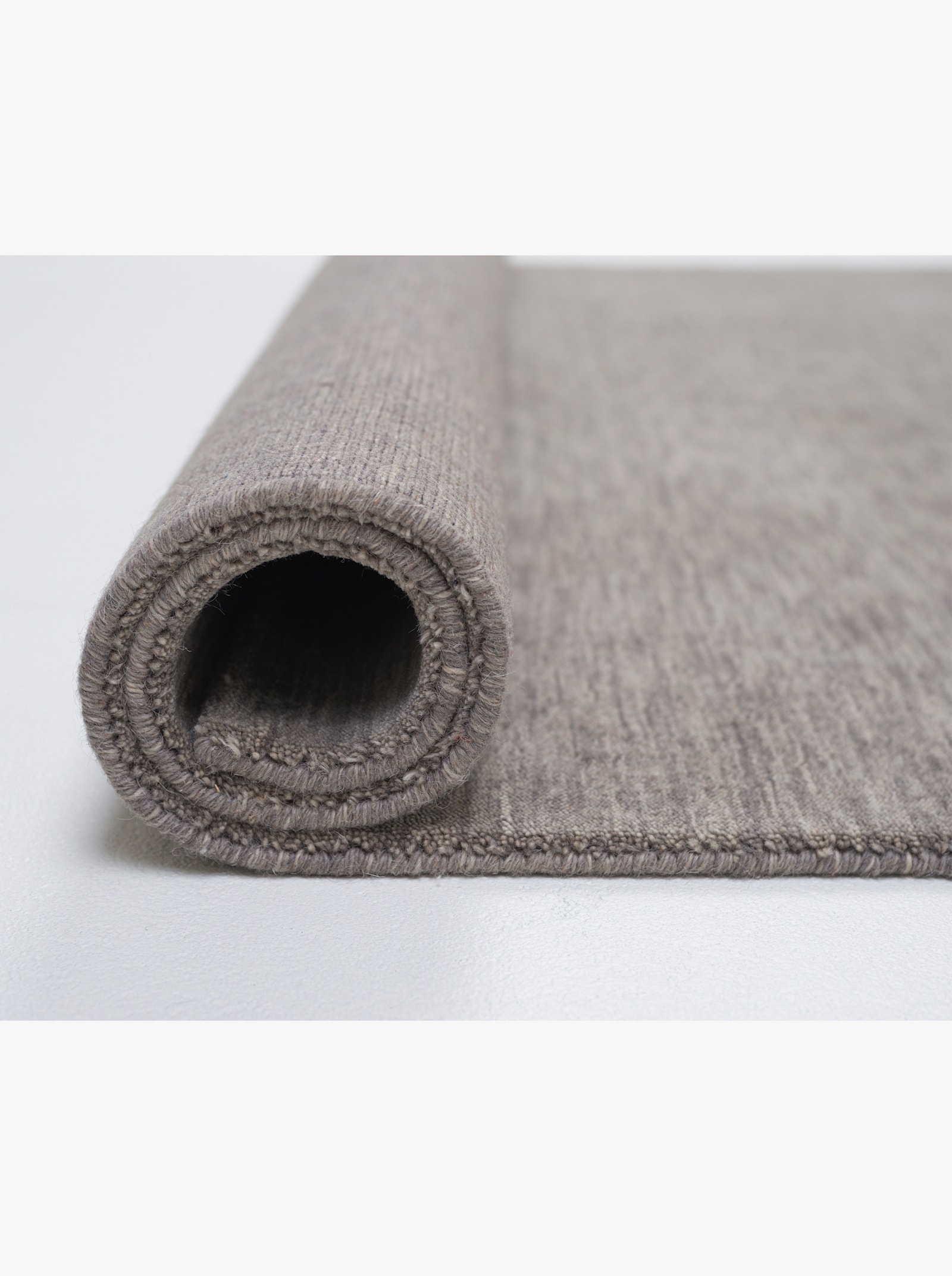 Theko Handwebteppich - grau