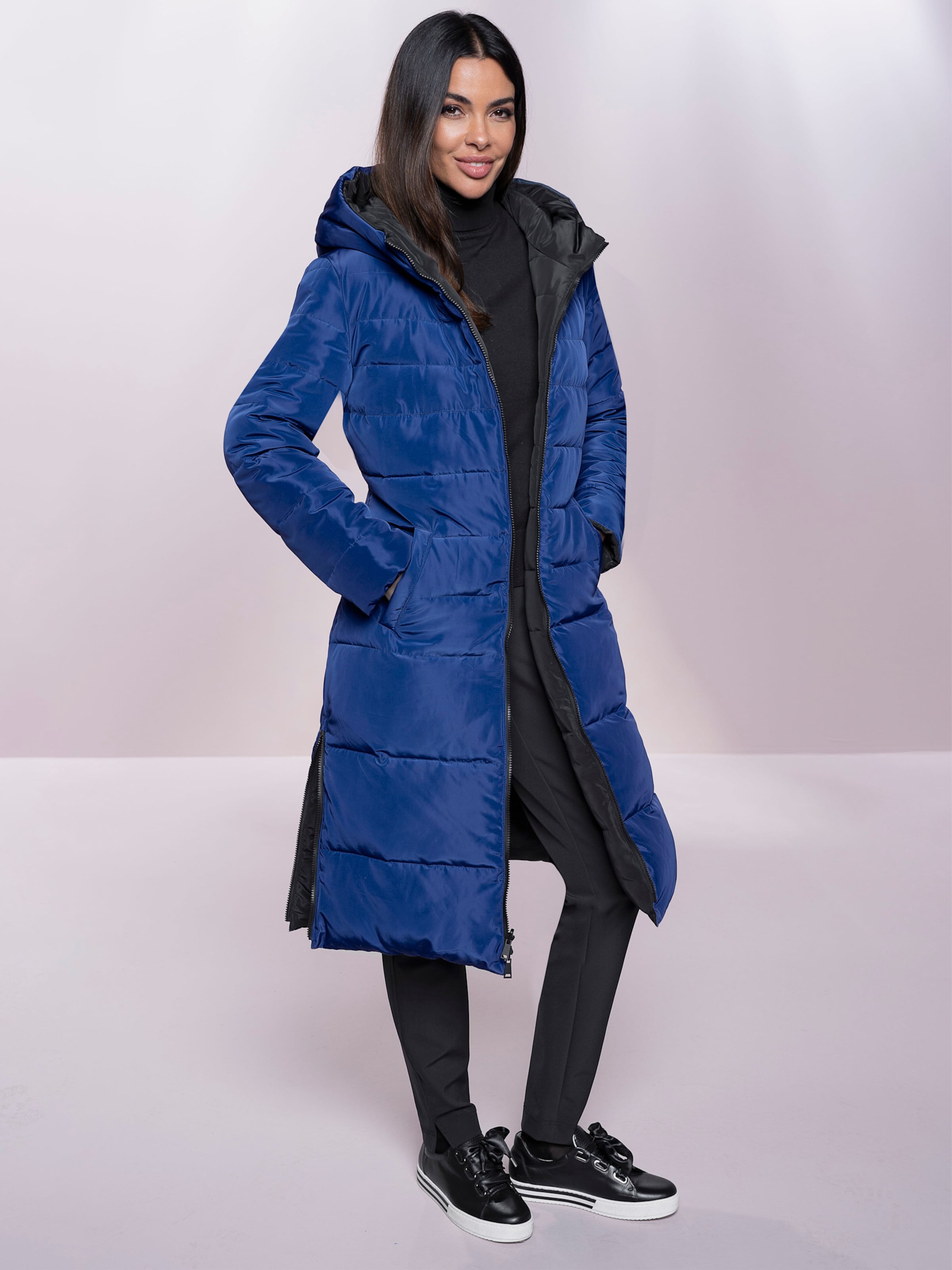 heine Steppmantel in schwarz-royalblau heine