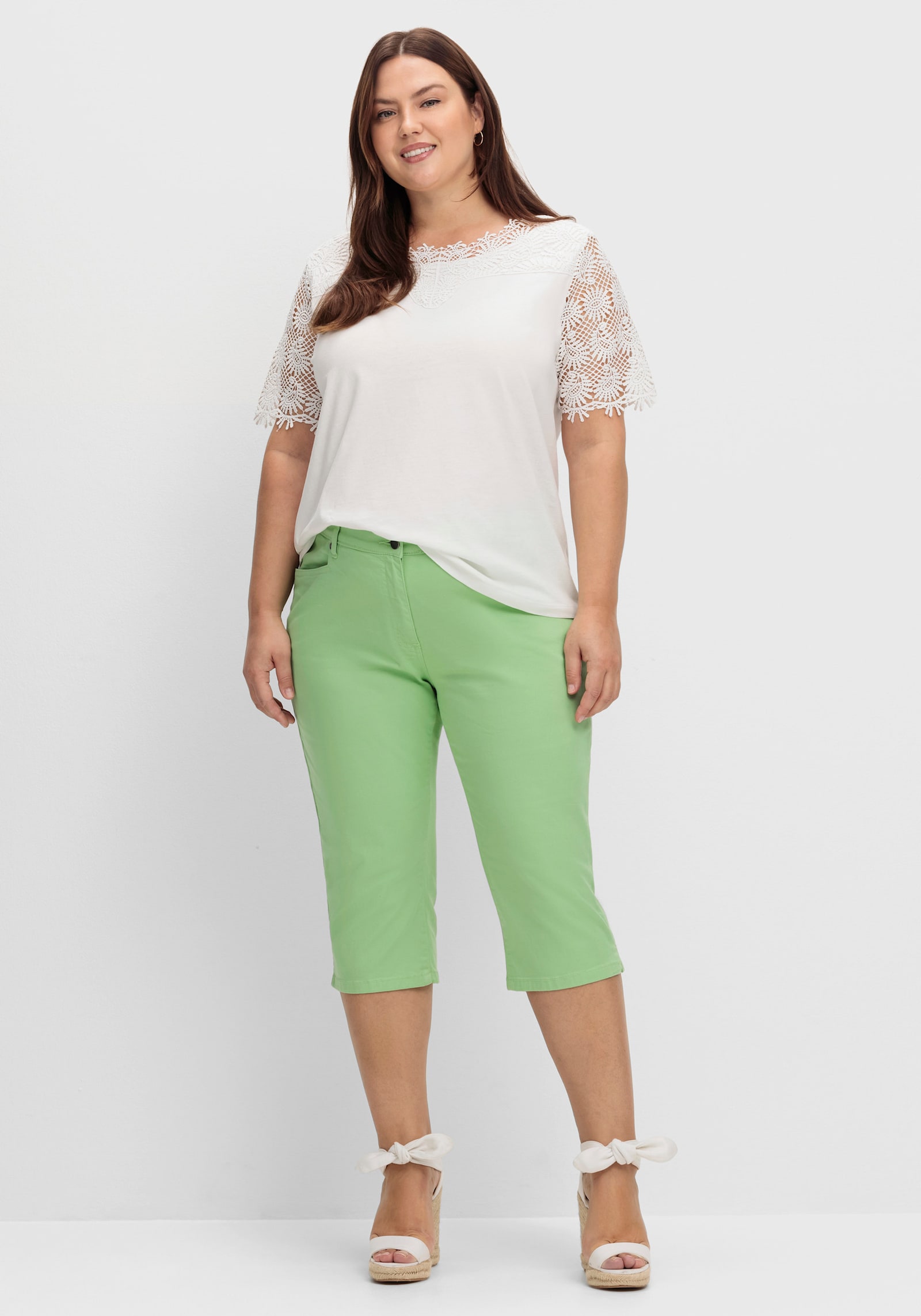 Caprijeans mit glitzerndem Katzenmotiv - reseda