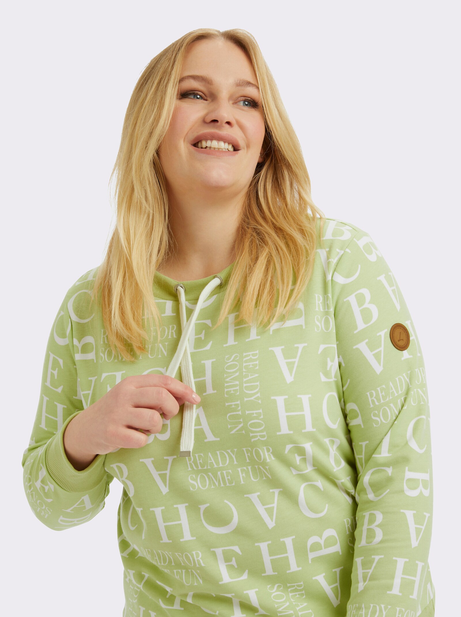 Sweatshirt mit Kordeldurchzug am Ausschnitt - pistazie-ecru-bedruckt