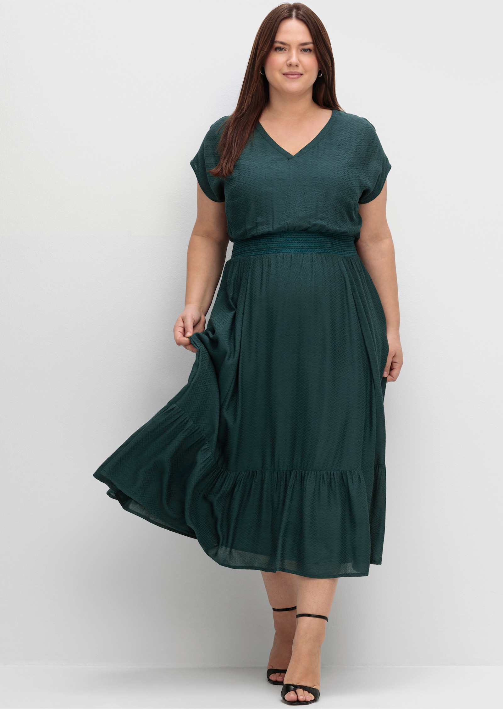 sheego Maxikleid mit Smokbund und Volant am Saum - tiefgrün