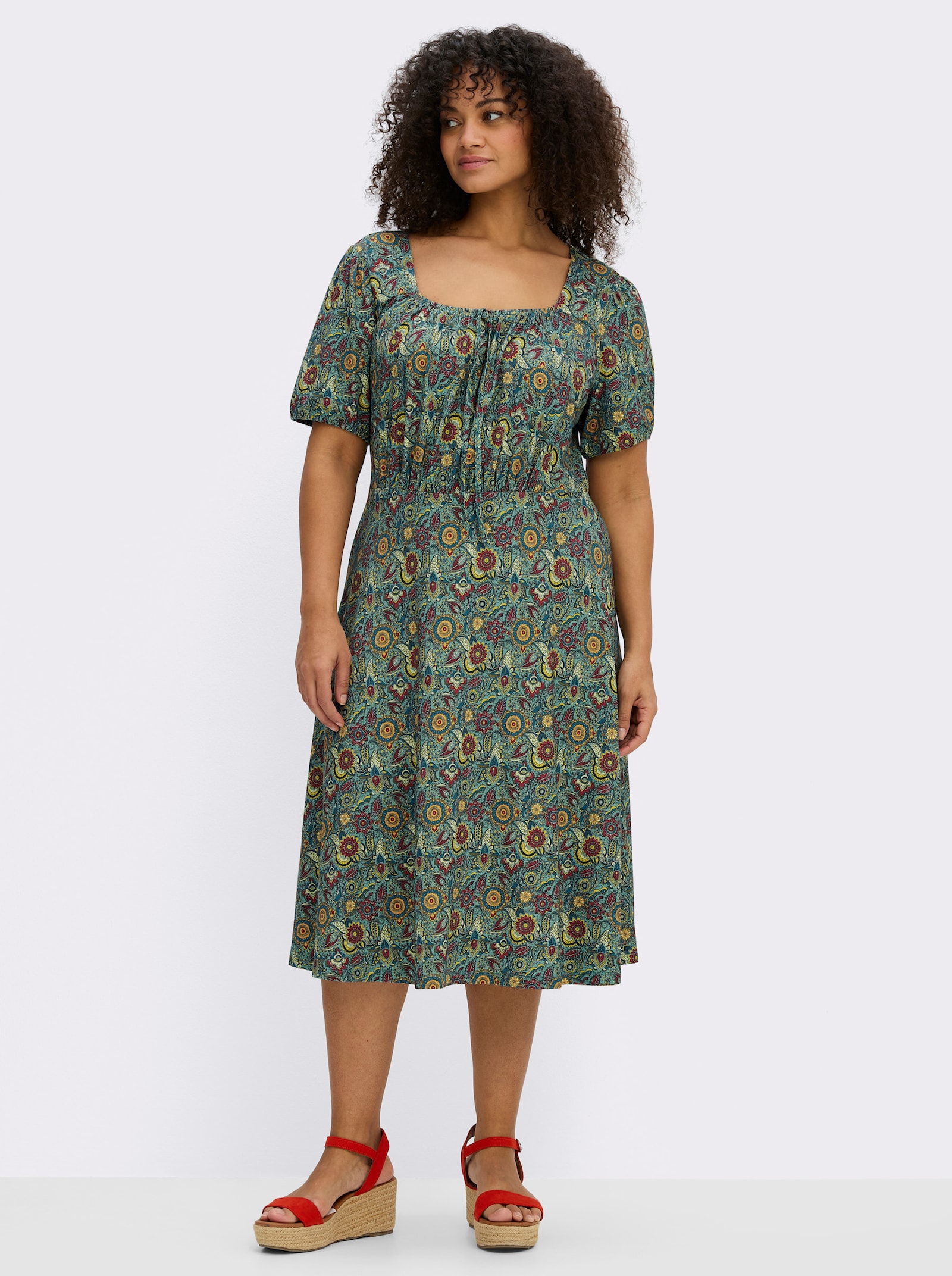sheego Jerseyjurk met bloemenprint - oceaan/diepblauw bedrukt