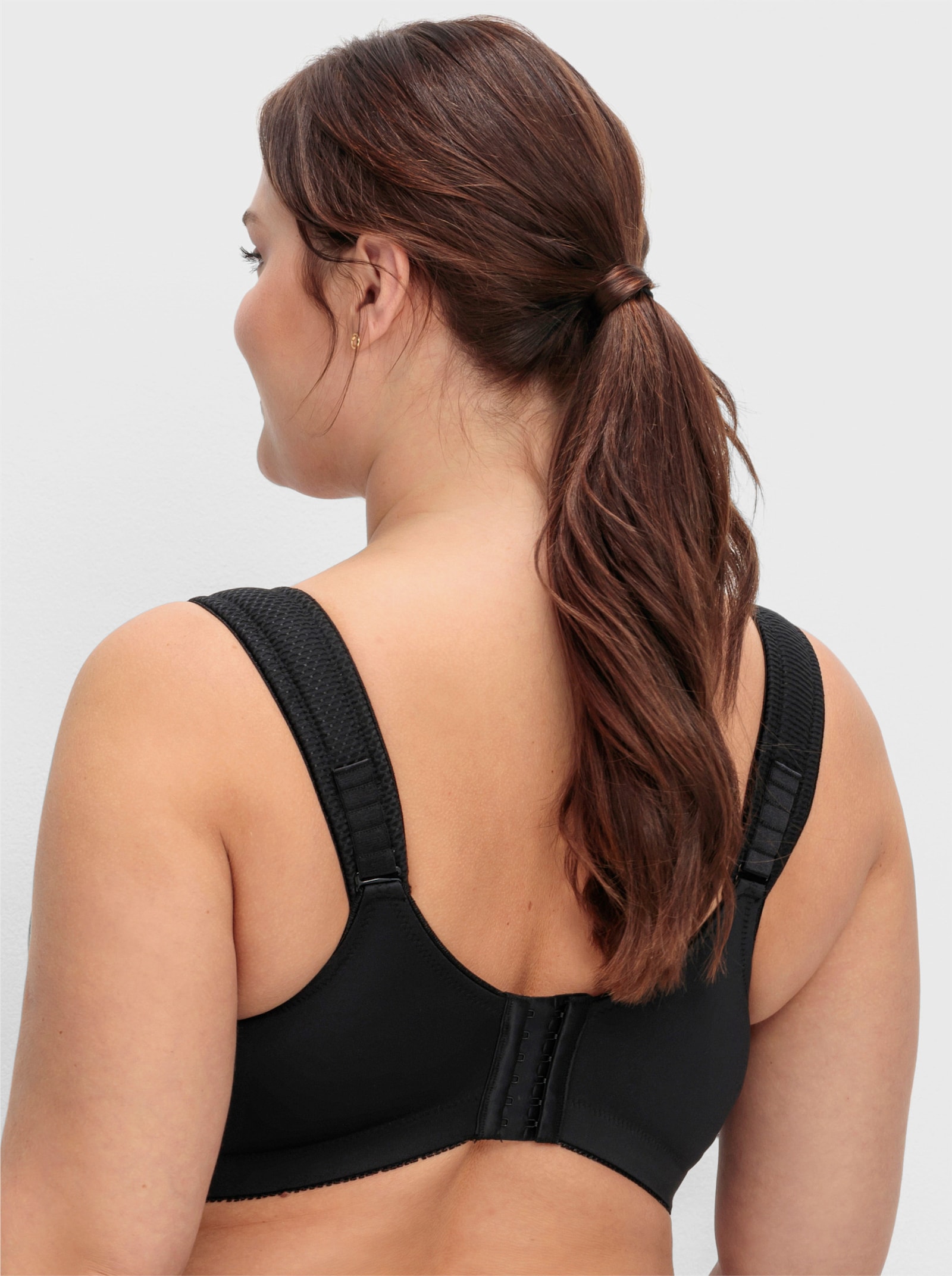 sheego Sportbeha zonder beugel met netinzetten - zwart