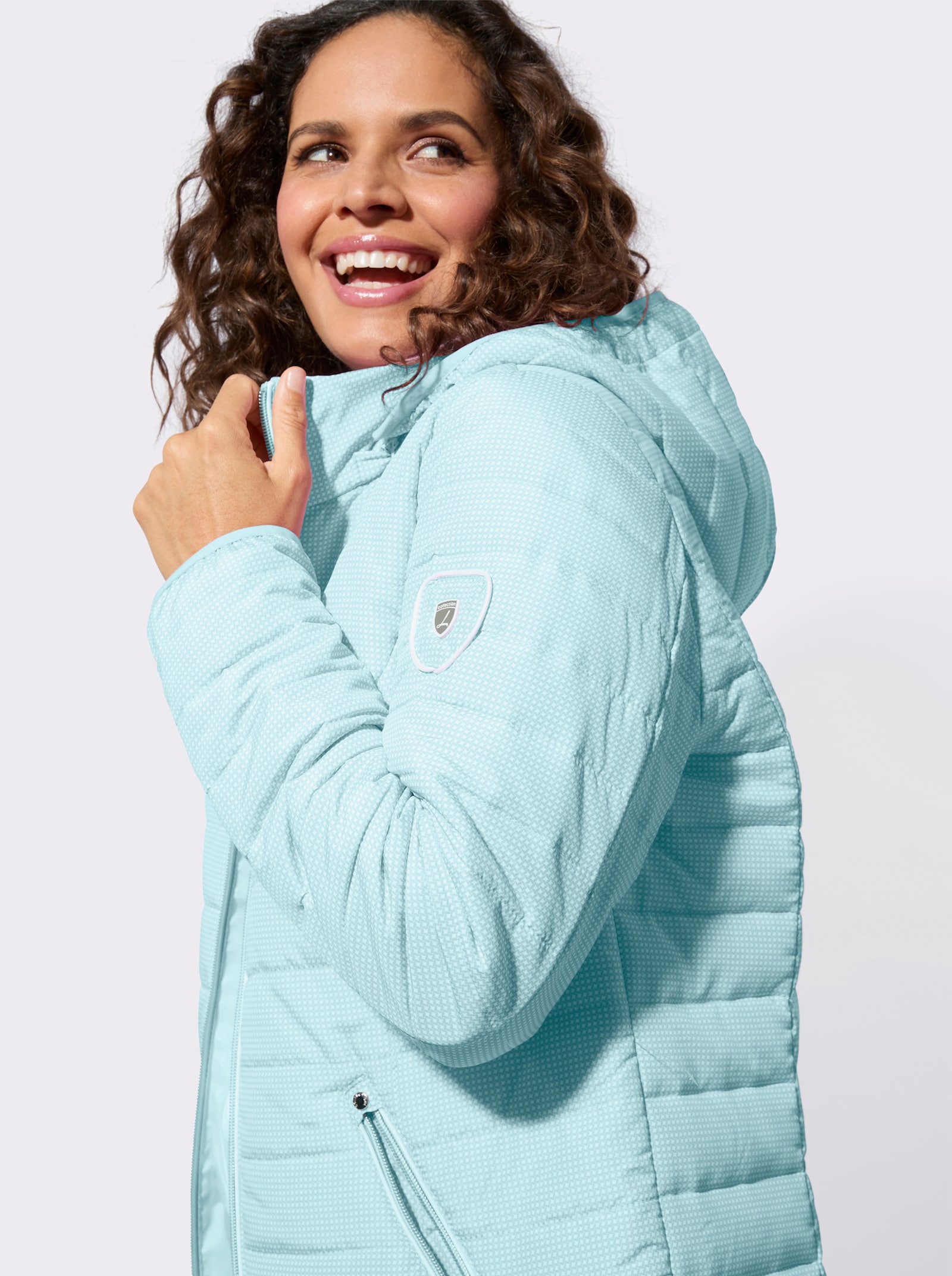 Gewatteerde jas met afneembare capuchon - mint/wit bedrukt