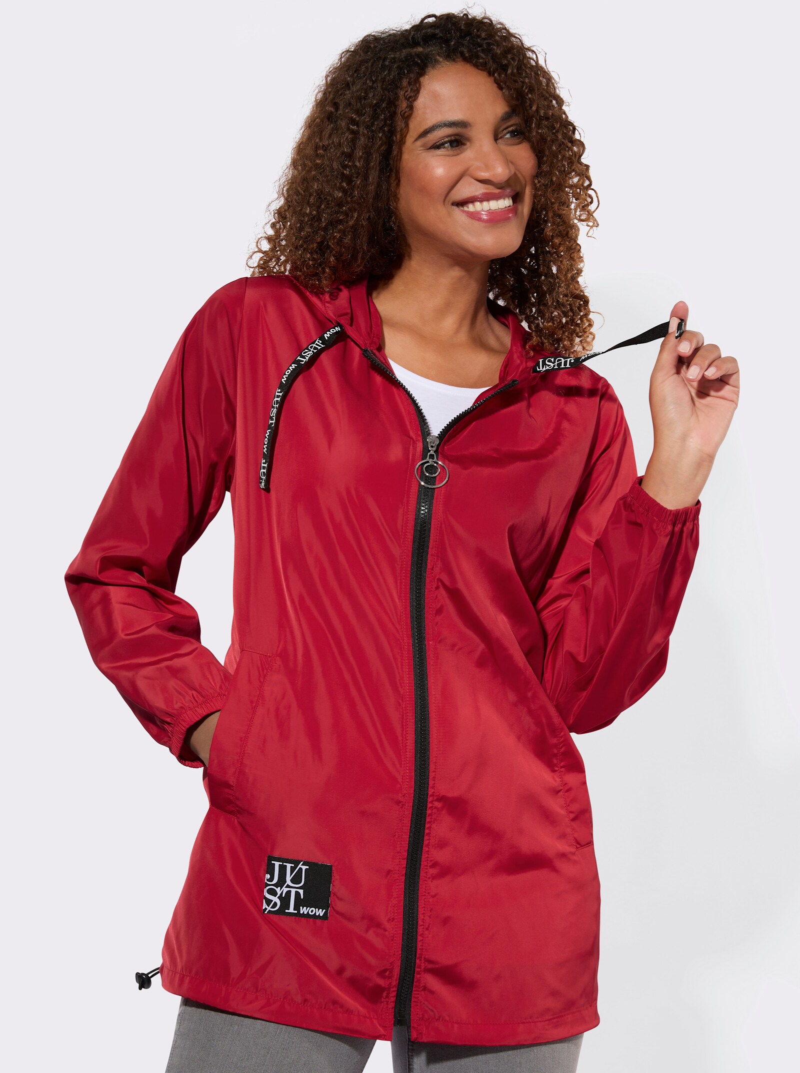 Kapuzenjacke mit Schriftzug im Comic-Stil - rot