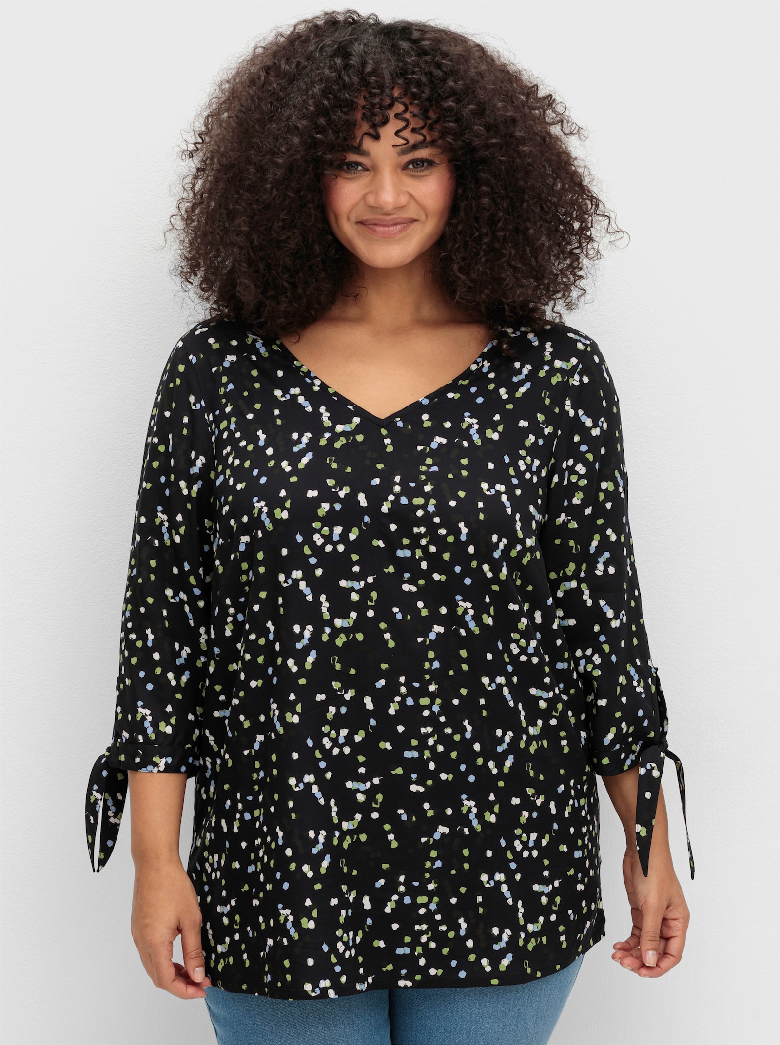 sheego Tunika mit Bindeband am Ärmel - schwarz-gemustert